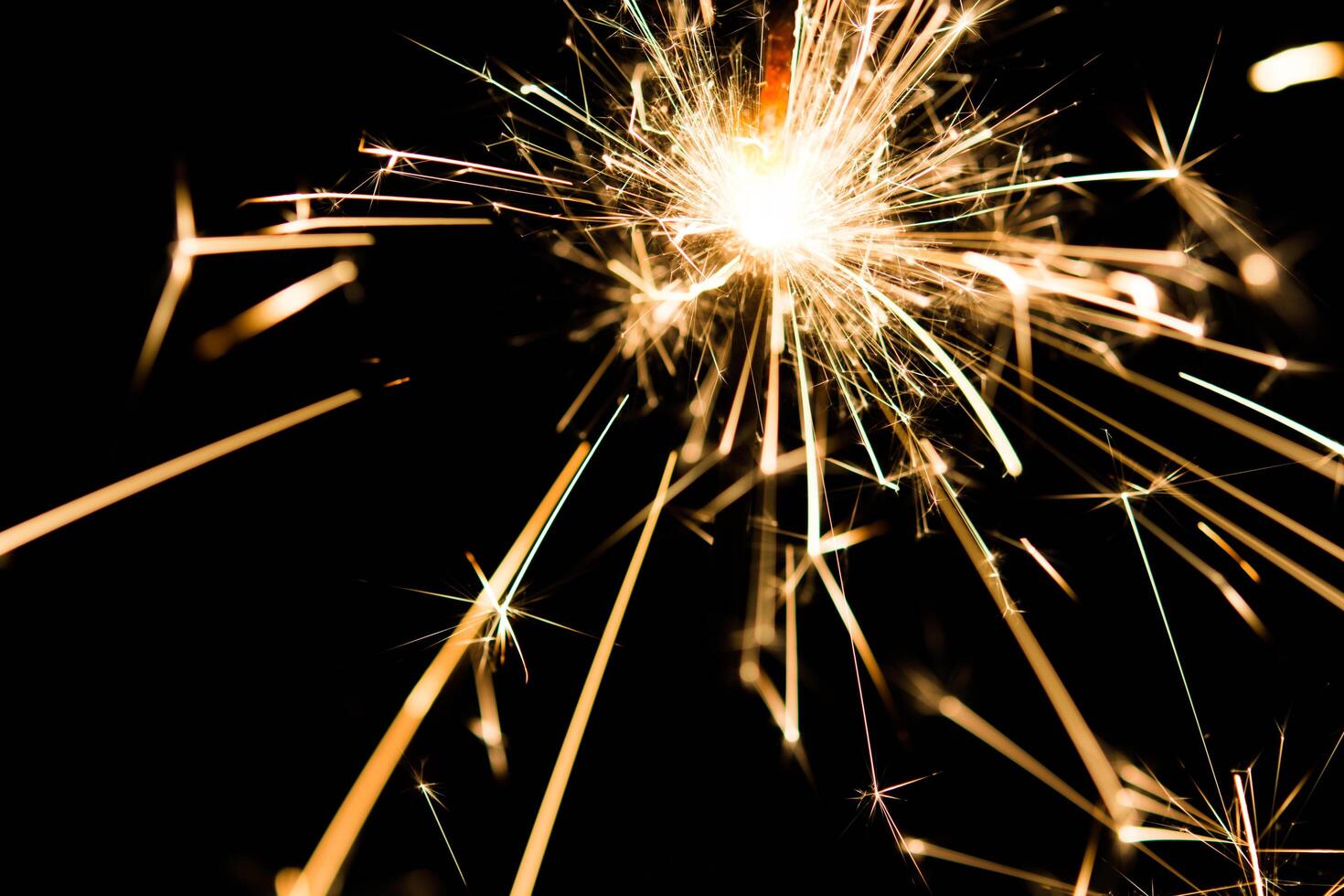 Christmas and newyear party sparkler on black photo