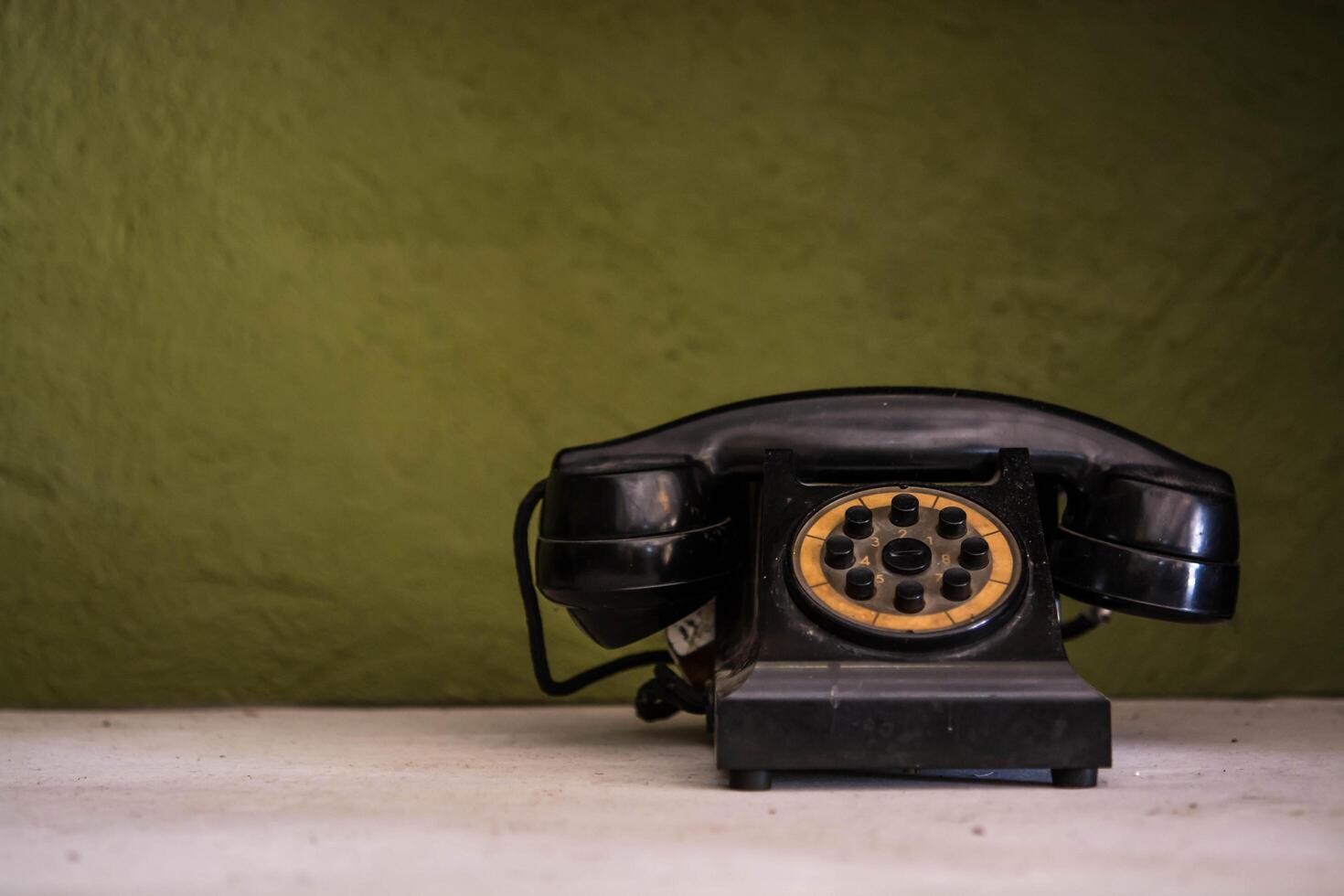 Retro telephone on table photo