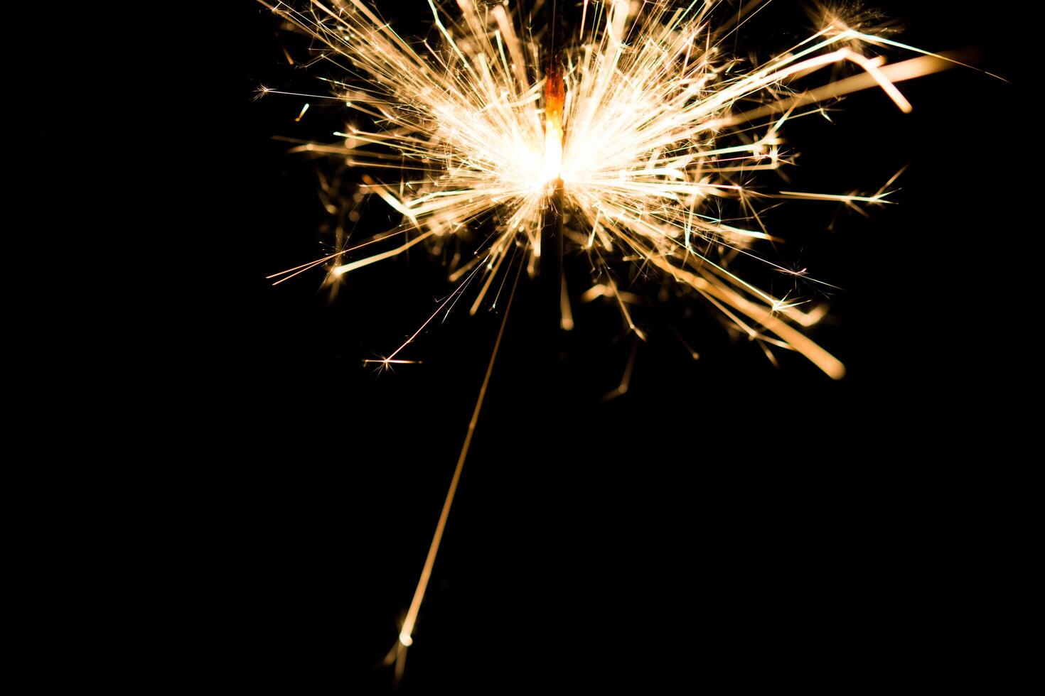 Christmas and newyear party sparkler on black photo