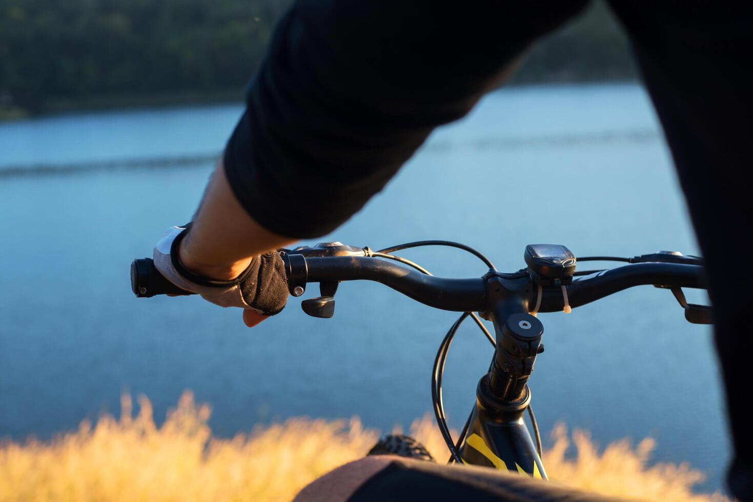 Cyclist on the mountain top of lake, Extreme and adventure life. photo