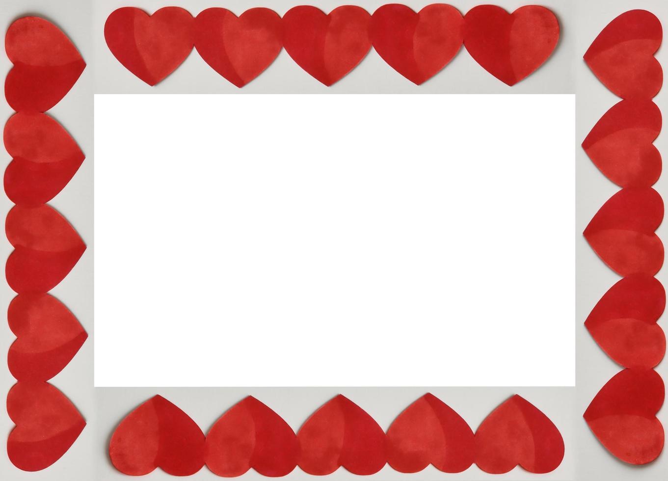 Red Valentines Hearts around a white square background. Place for text, copy space. Top view. Happy Valentine's Day concept. photo