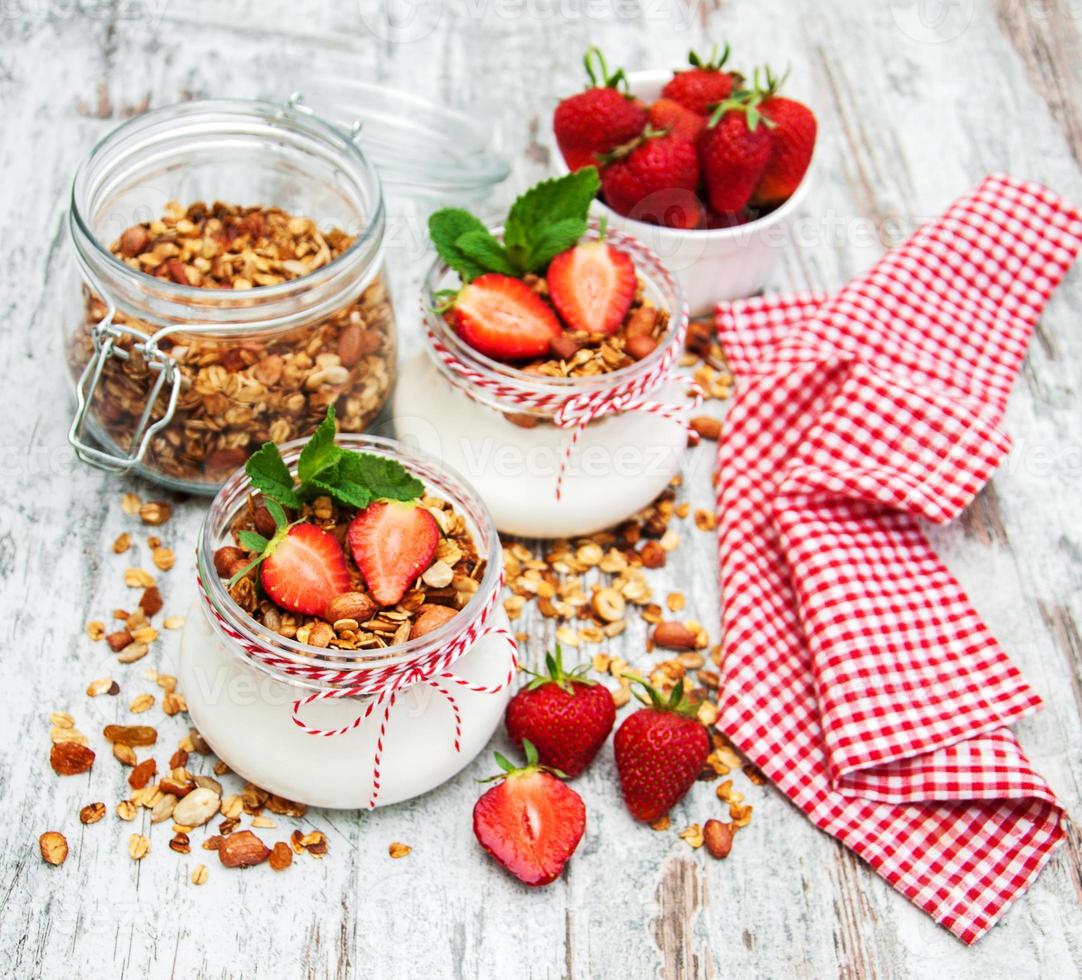 Yogurt and granola for breakfast photo