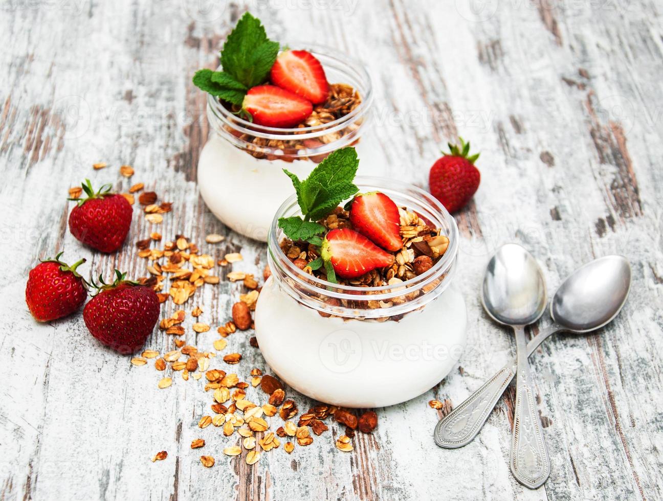 Yogurt and granola for breakfast photo