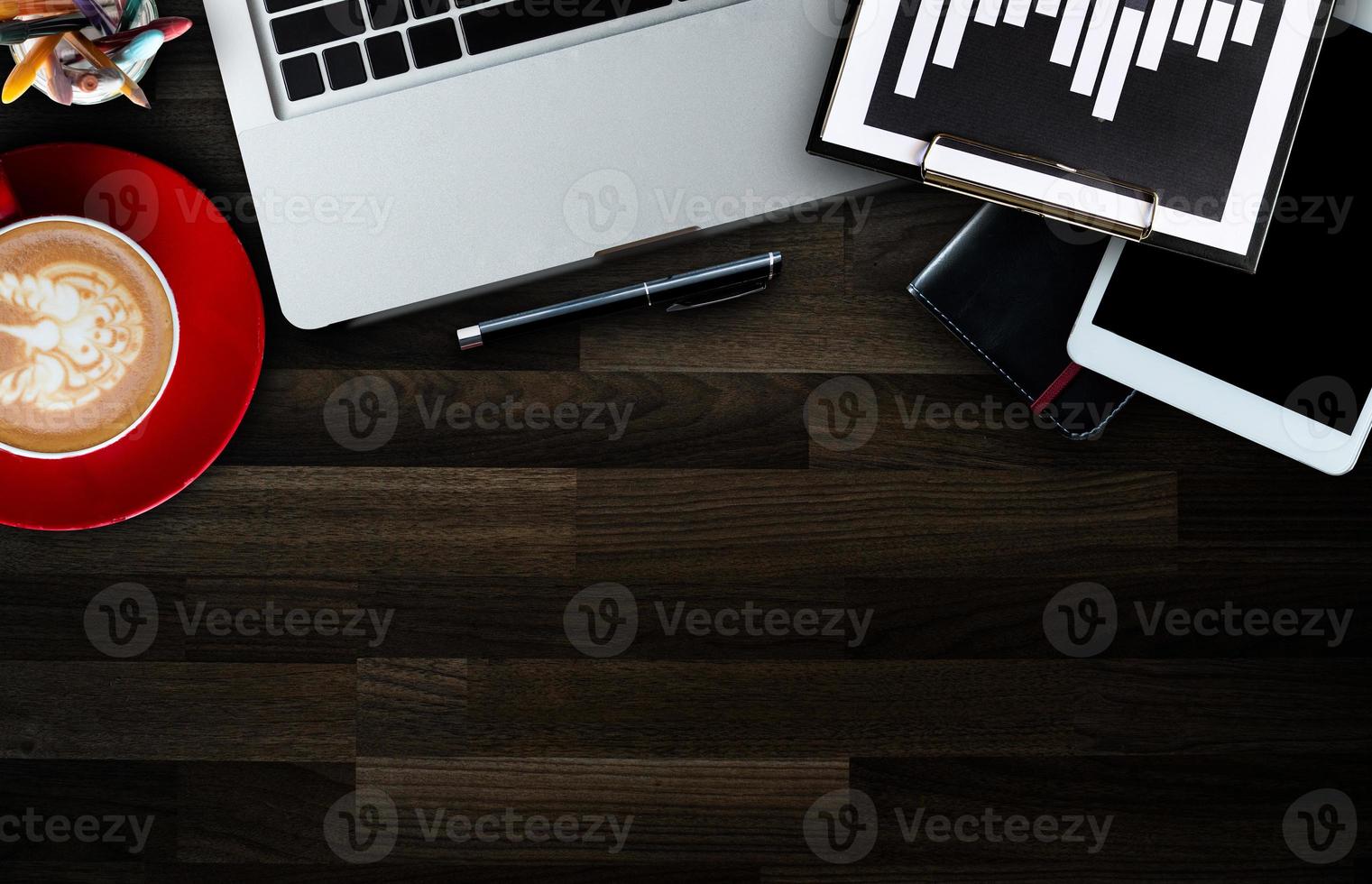 Top view of office desktop with various supplies and devices. Workplace concept photo