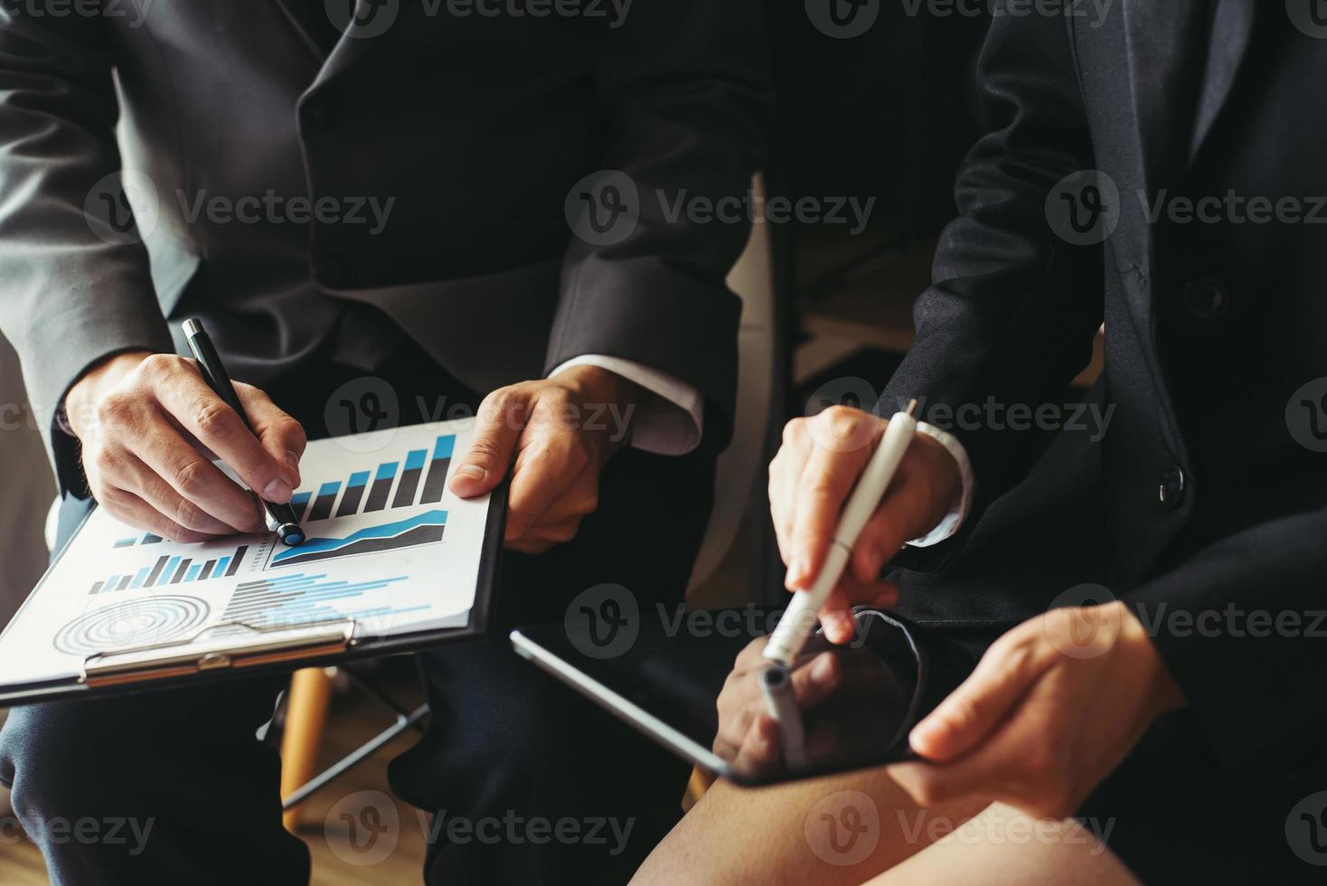 Two business meeting professional investor  working together with smart phone and laptop and digital tablet computer in office space photo