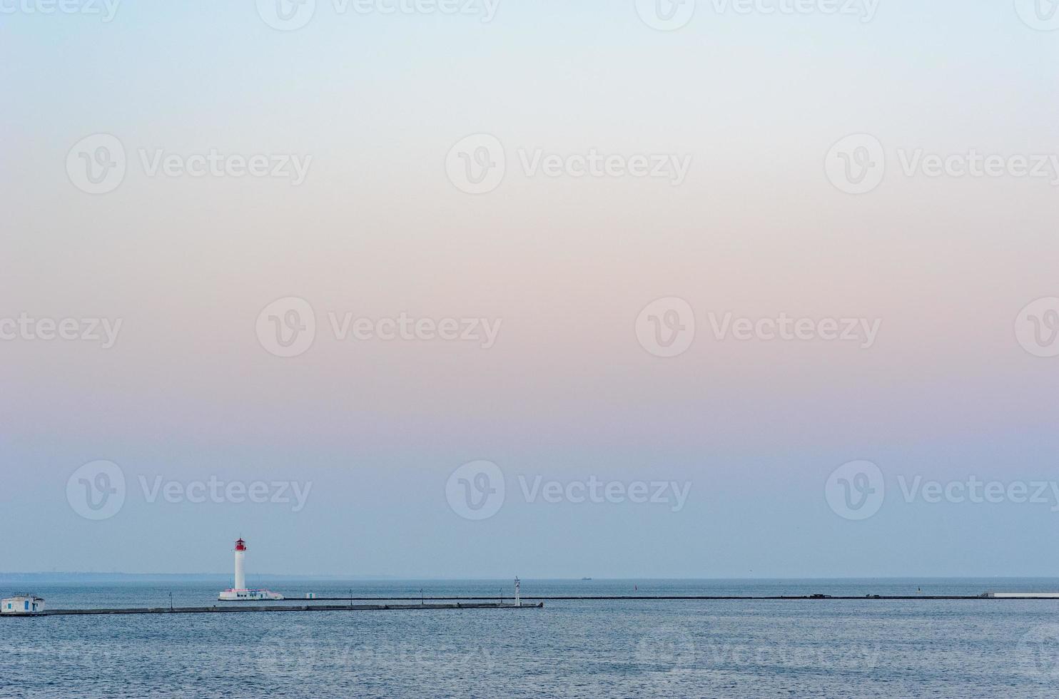 blue sea background with lighthouse on sea, island landscape. Blue sea background with seagull, mountains, beautiful sky and lighthouse. Navigation Beacon building in ocean. photo