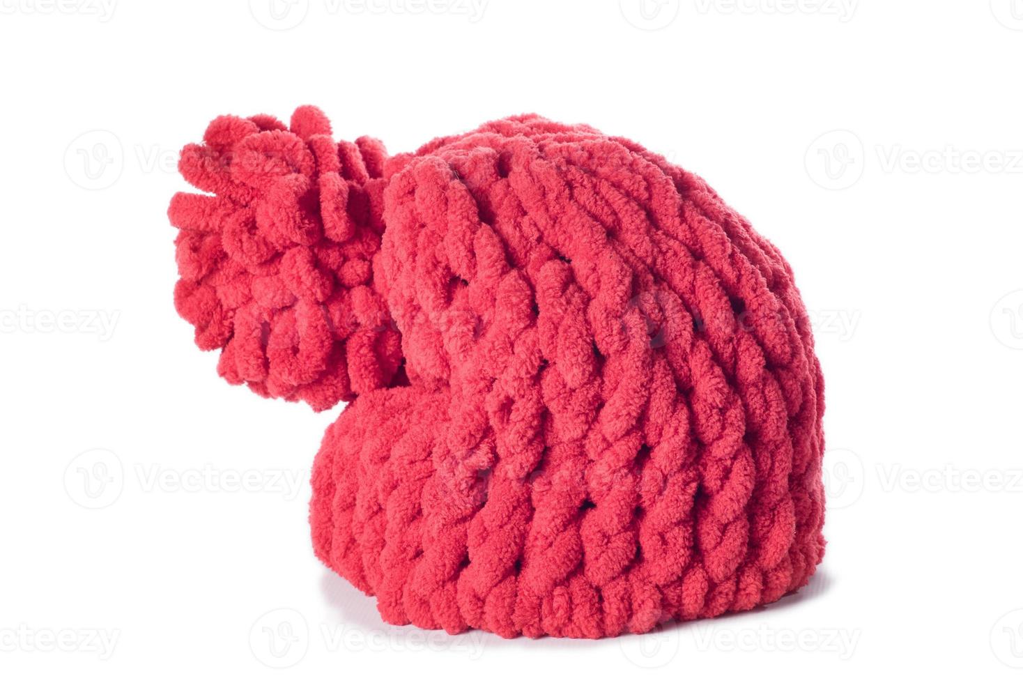 red winter knitted woolen hat isolated on white background photo