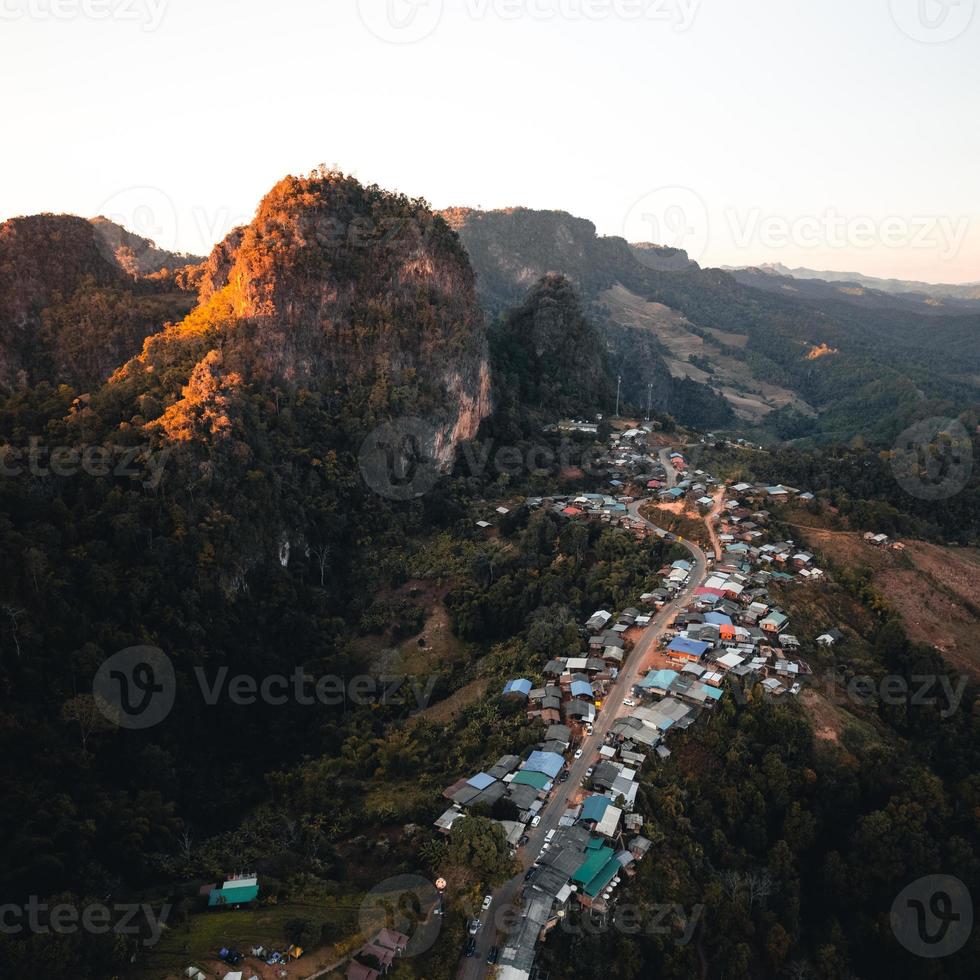 Mountains and sunset light in the evening at a rural village photo