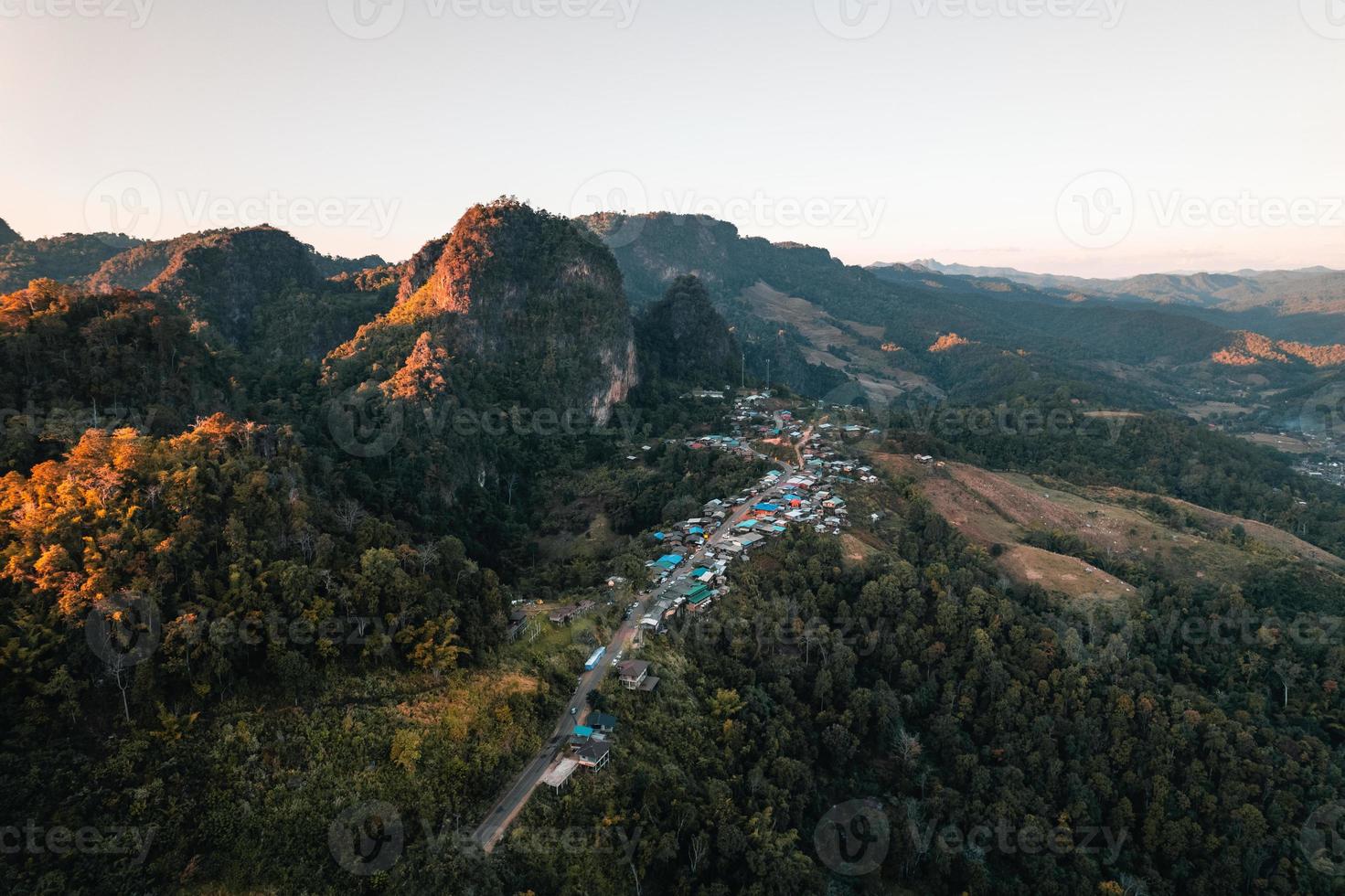 Mountains and sunset light in the evening at a rural village photo