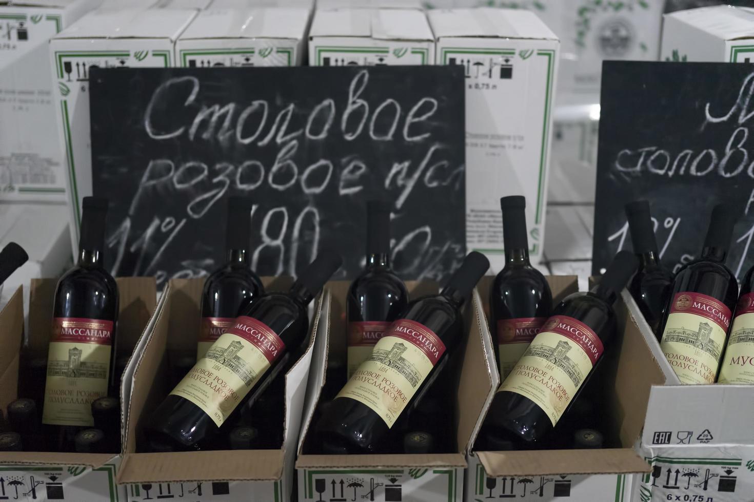 Yalta, Crimea-may 30, 2018- Massandra winery Warehouse with wine bottles and price tags. photo