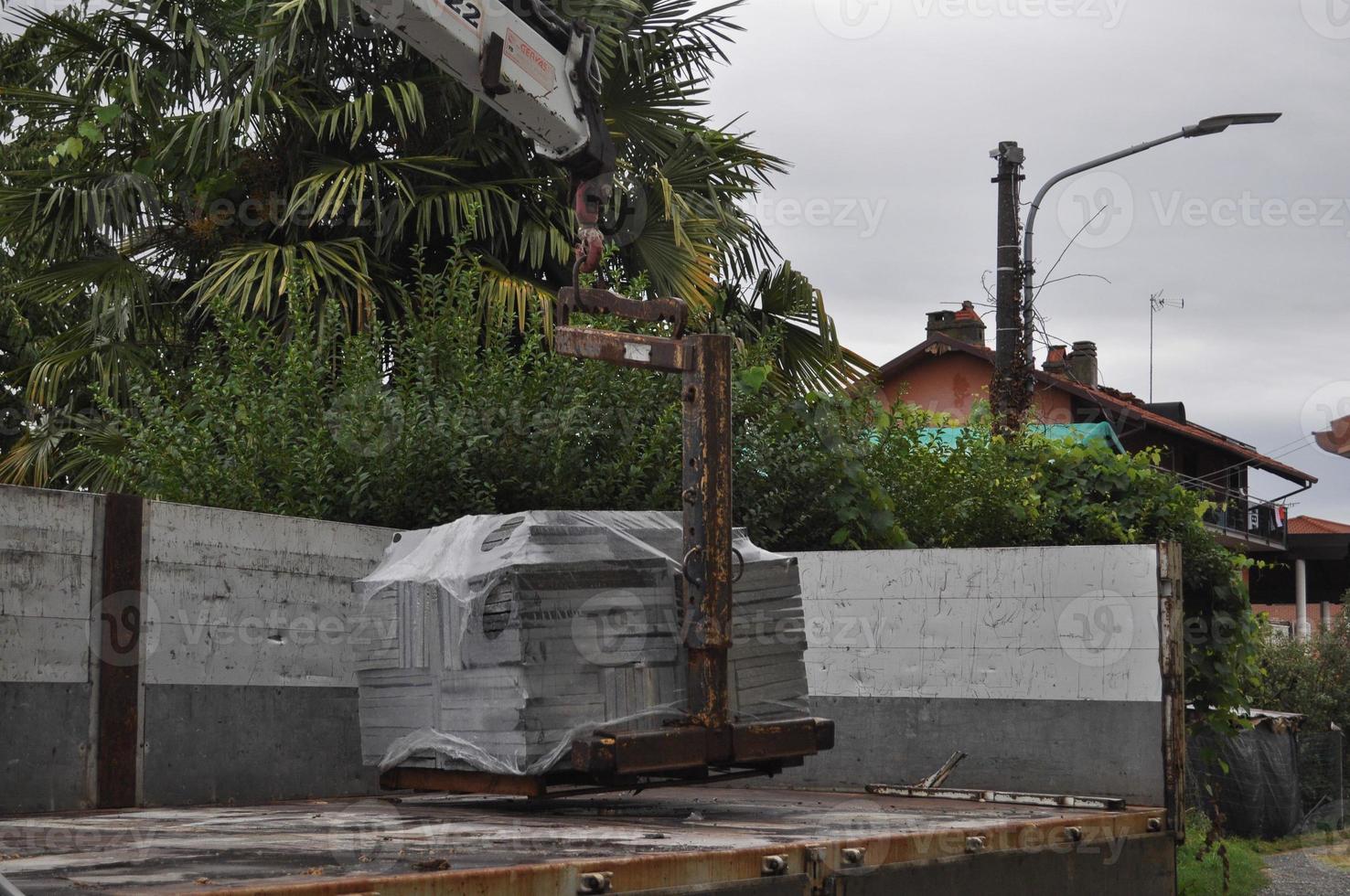 loading or unloading of stone tiles photo