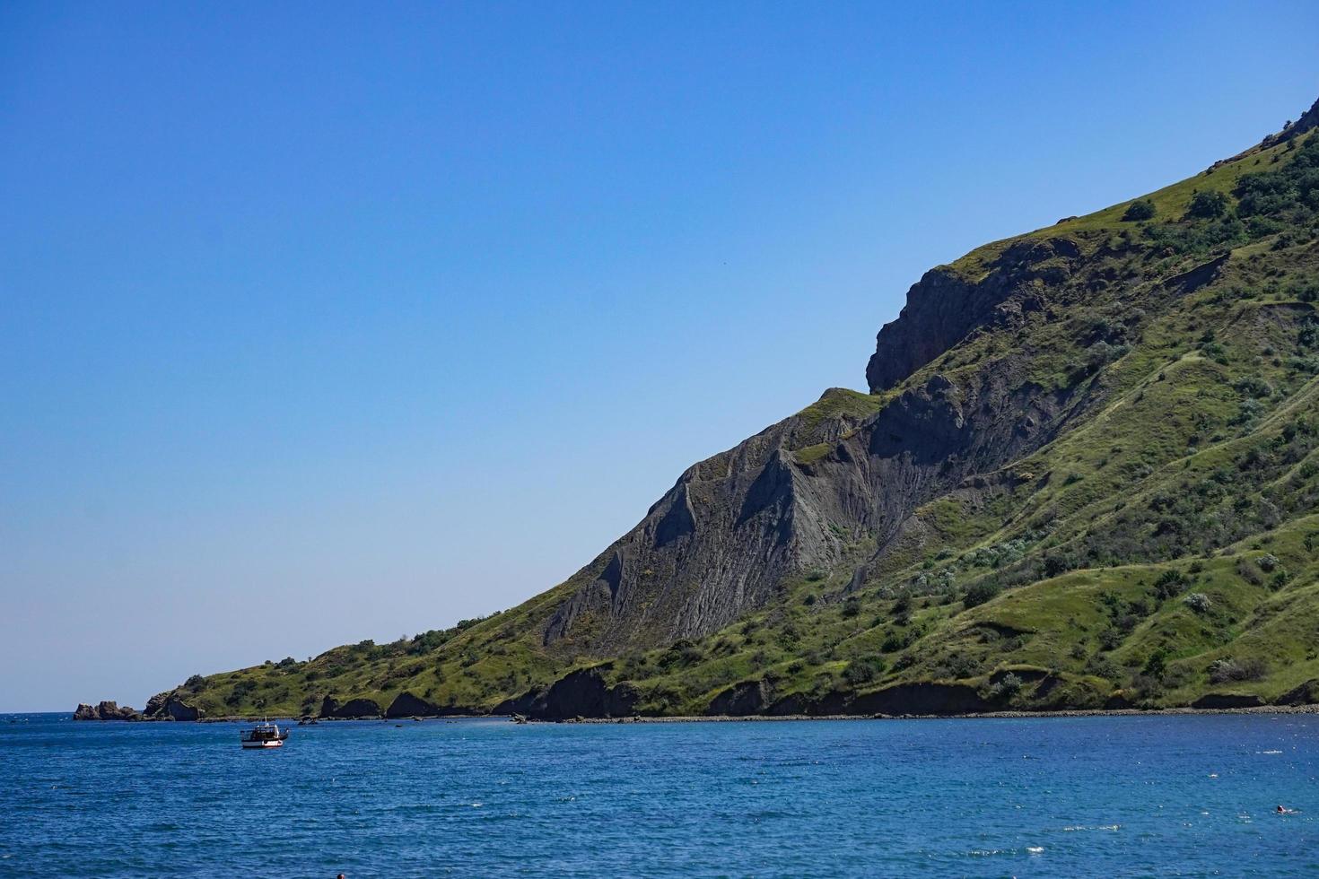 Seascape with a view of the coastline and the calm blue sea. photo