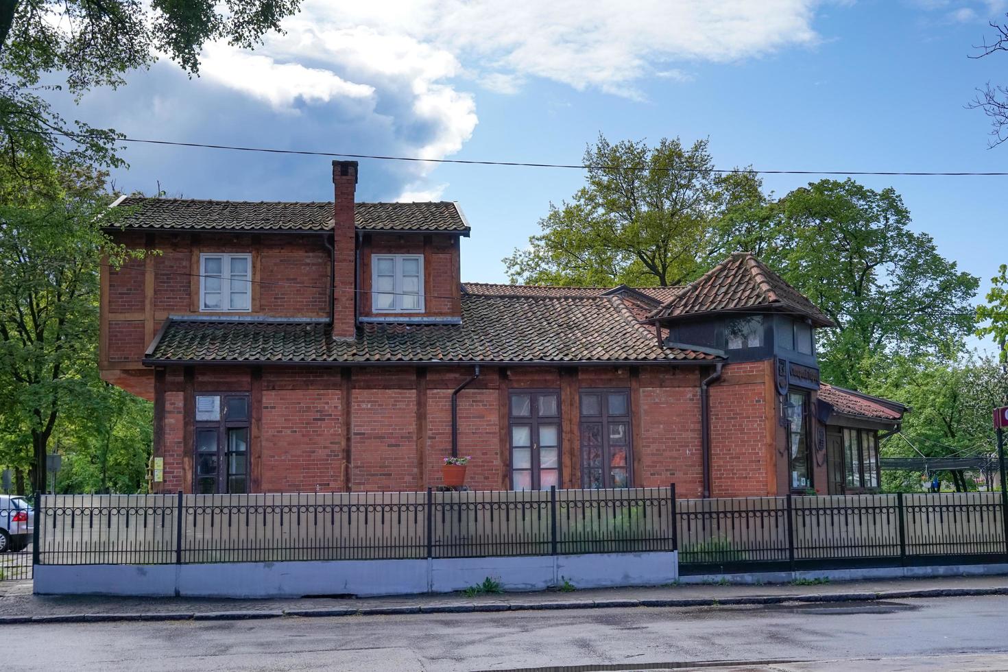 Zelenogradsk, Russia-may 17, 2016 - An old red brick building with a tiled roof. photo