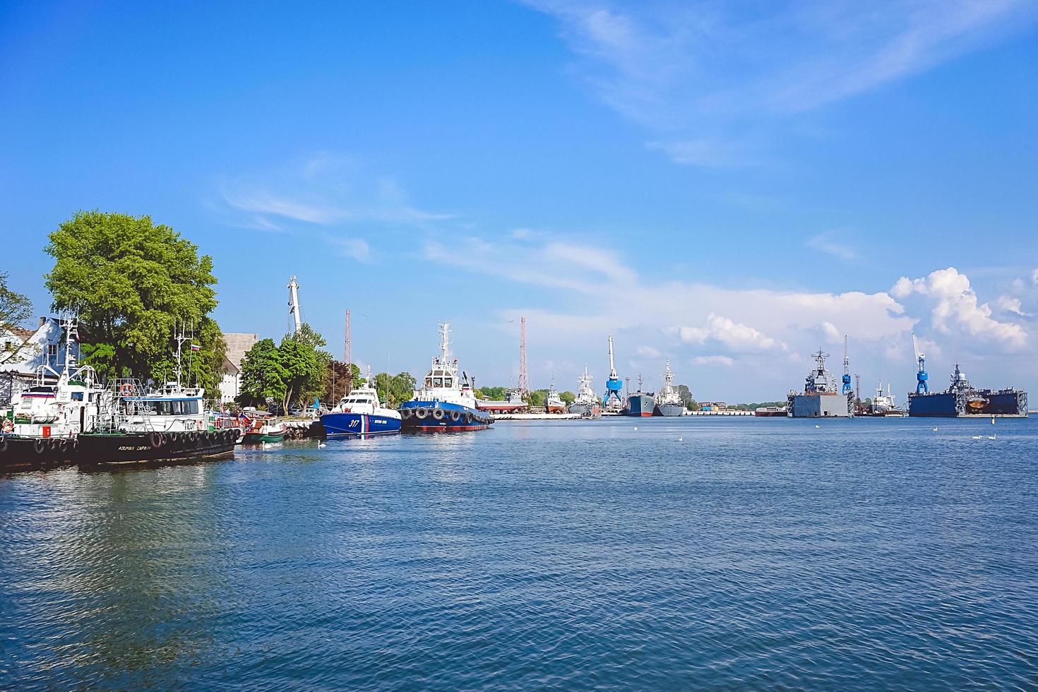 Baltiysk, Russia-may 15, 2016- Seascape with war ships under the blue sky. photo
