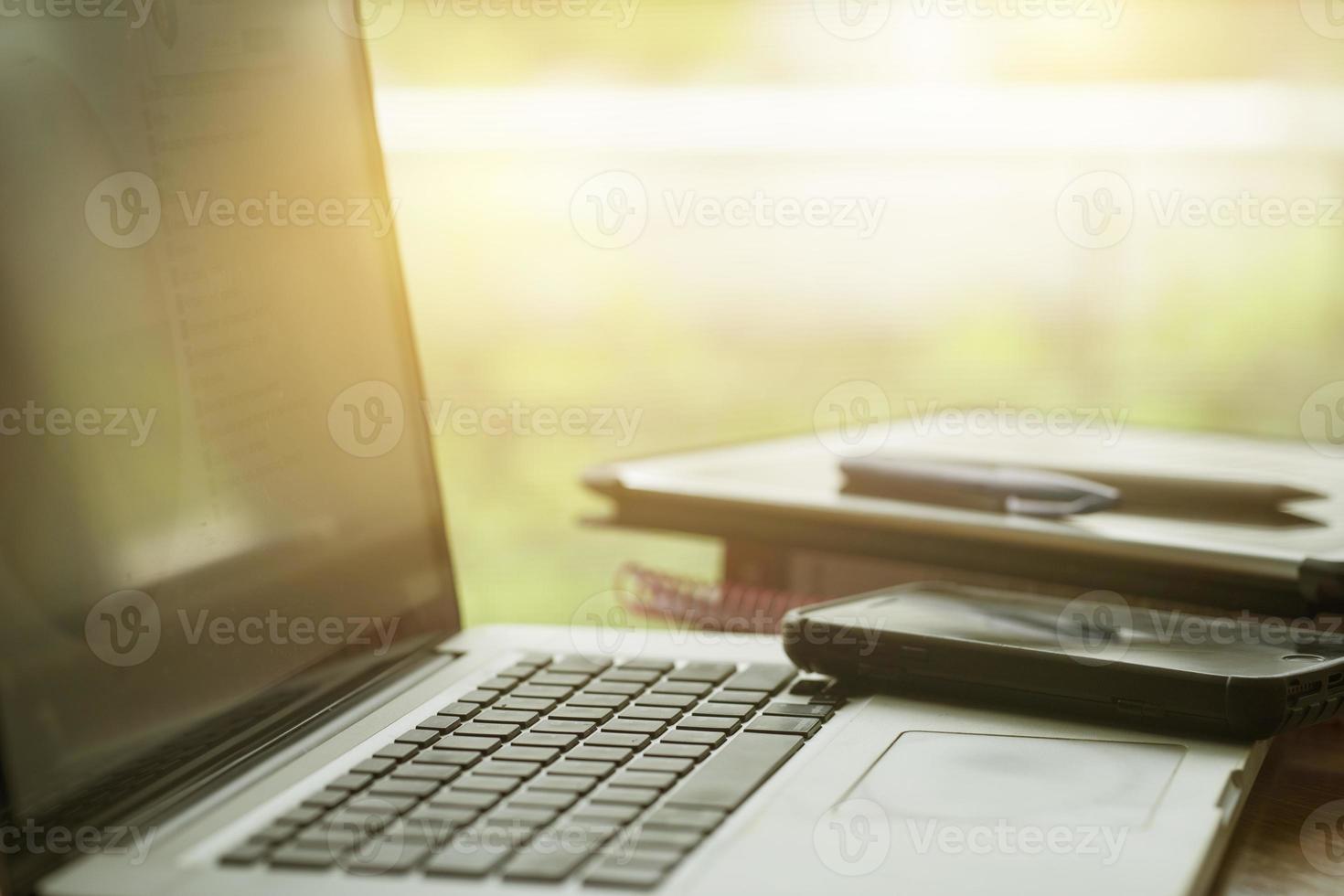 LAPTOP AND TABLET ON THE TABLE photo