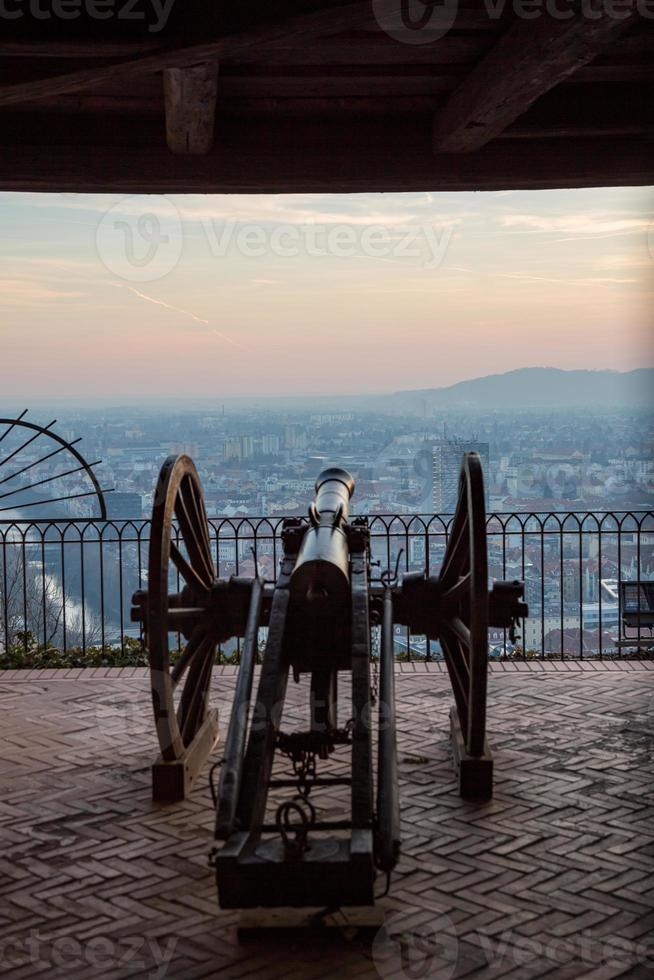 Cannon on the wall of the Schlossberg hill of Graz, Austria is aimed to defend the city. photo