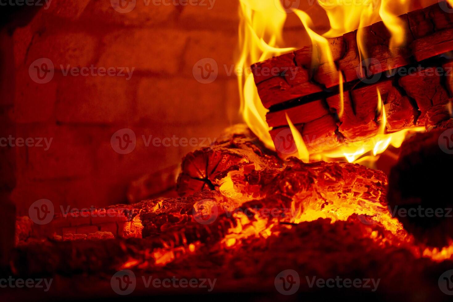 Burning log of wood in a fireplace closeup. 5392487 Stock Photo at