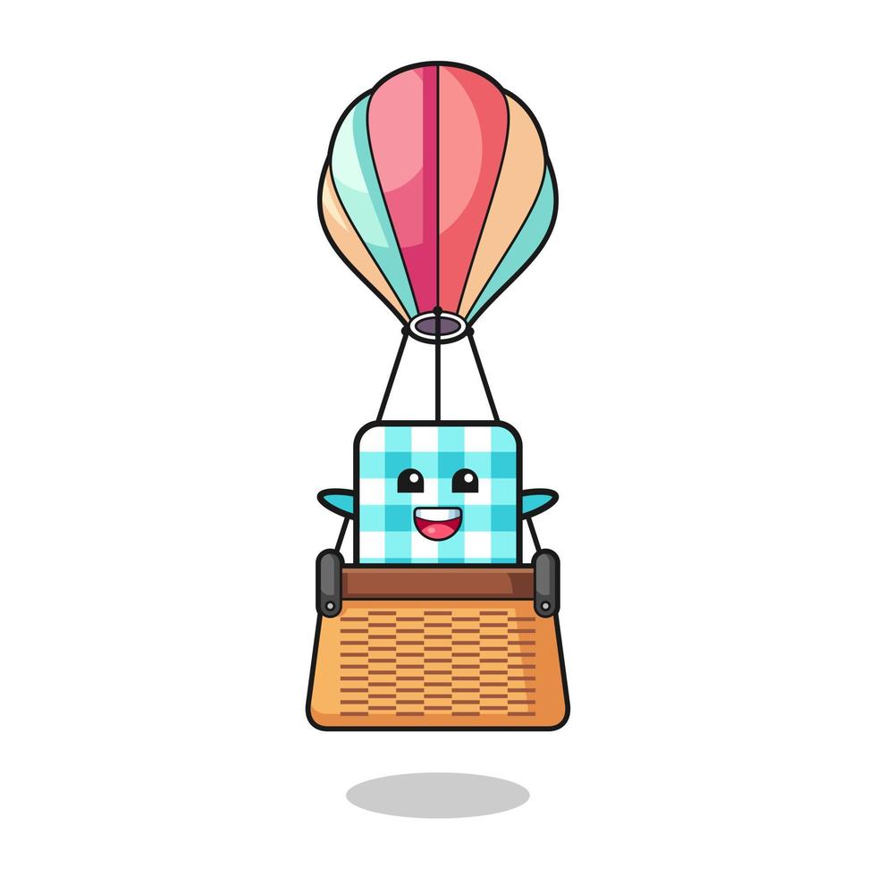 checkered tablecloth mascot riding a hot air balloon vector