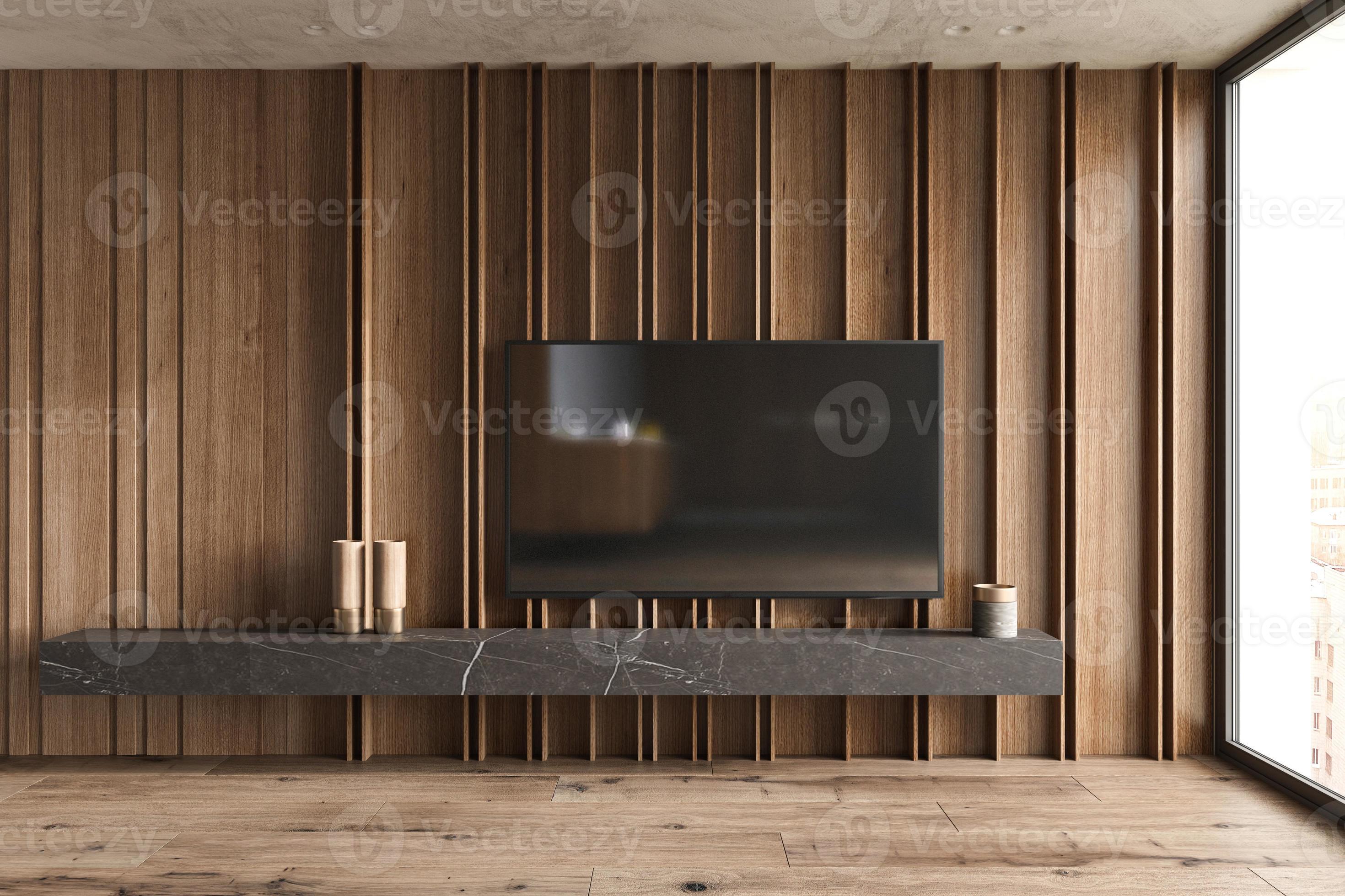 Smart TV mounted hang on wooden panels wall in living room with shelf and decor in modern