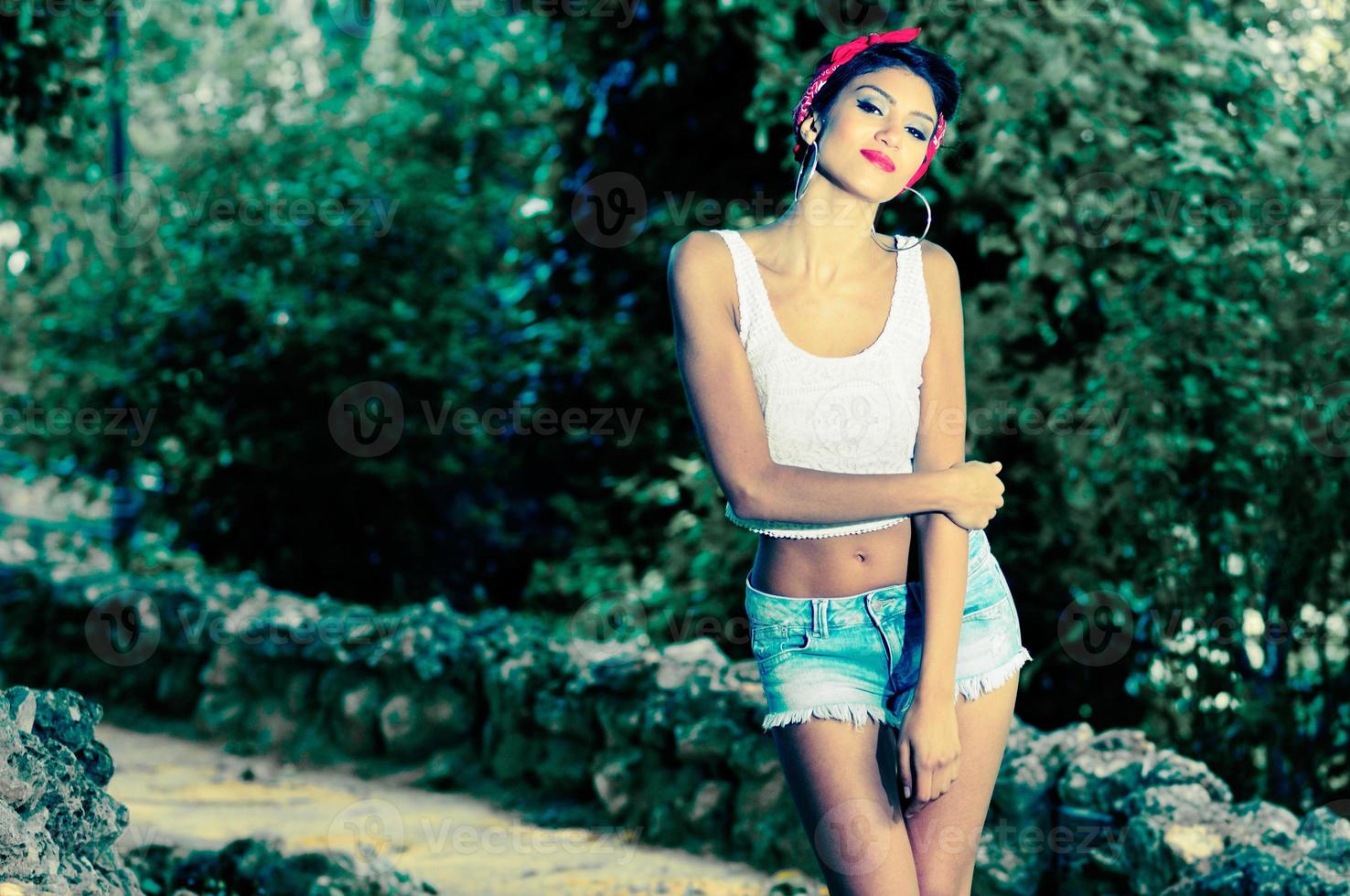 Pin-up girl. American style, in a garden photo