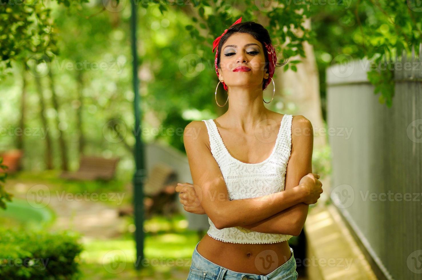 Pin-up girl. American style, in a garden photo