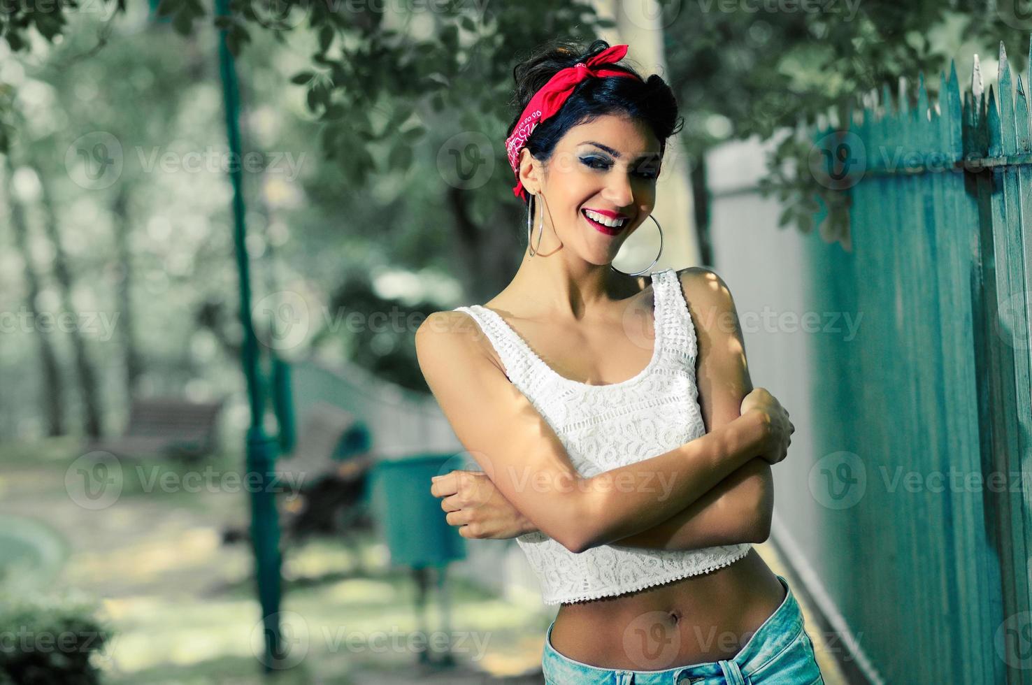 Pin-up girl. American style, in a garden photo