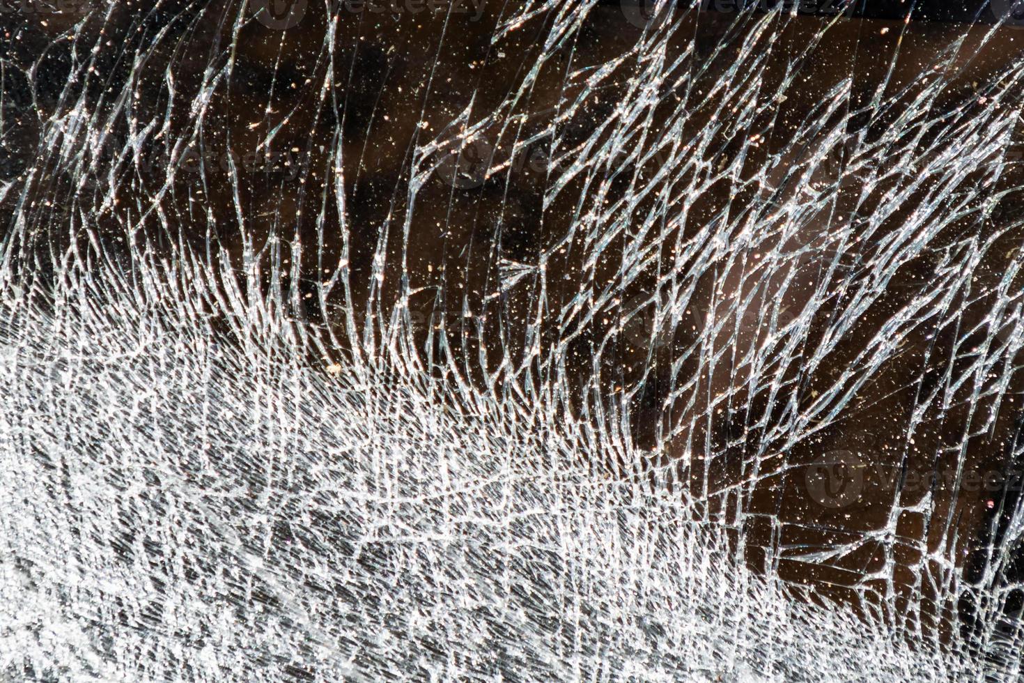 Cracked and abstract glass texture. Transparent material backdrop. Glass effect pattern. Mirror and glass background. photo