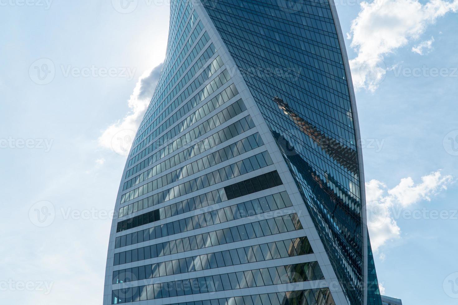 High rise buildings of the business center of Moscow. District Moscow-city against the day sky with clouds photo