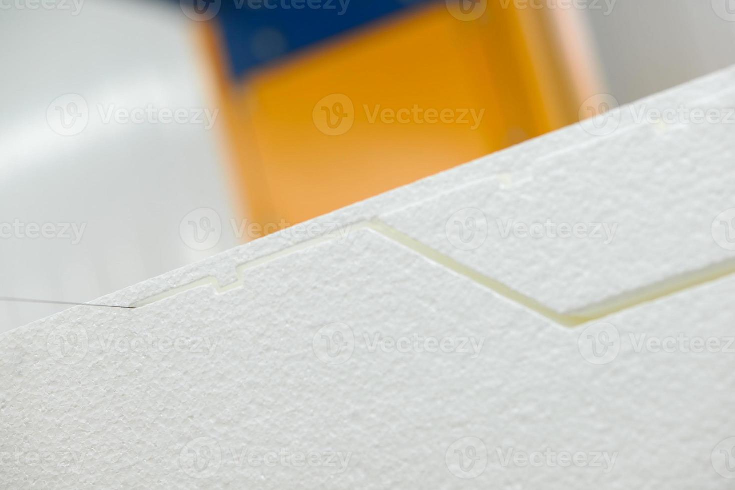 The machine cuts foam plastic. Plant for the production of sandwich panels from styrofoam photo
