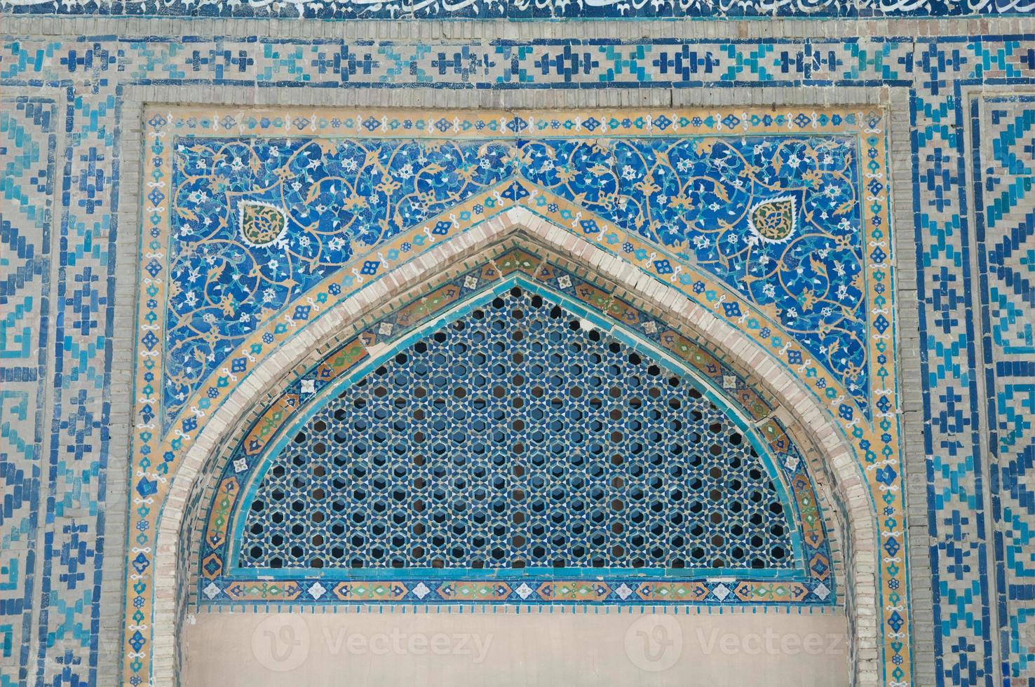 Dome in the form of an arch in traditional Asian mosaic. Details of the architecture of medieval Central Asia photo