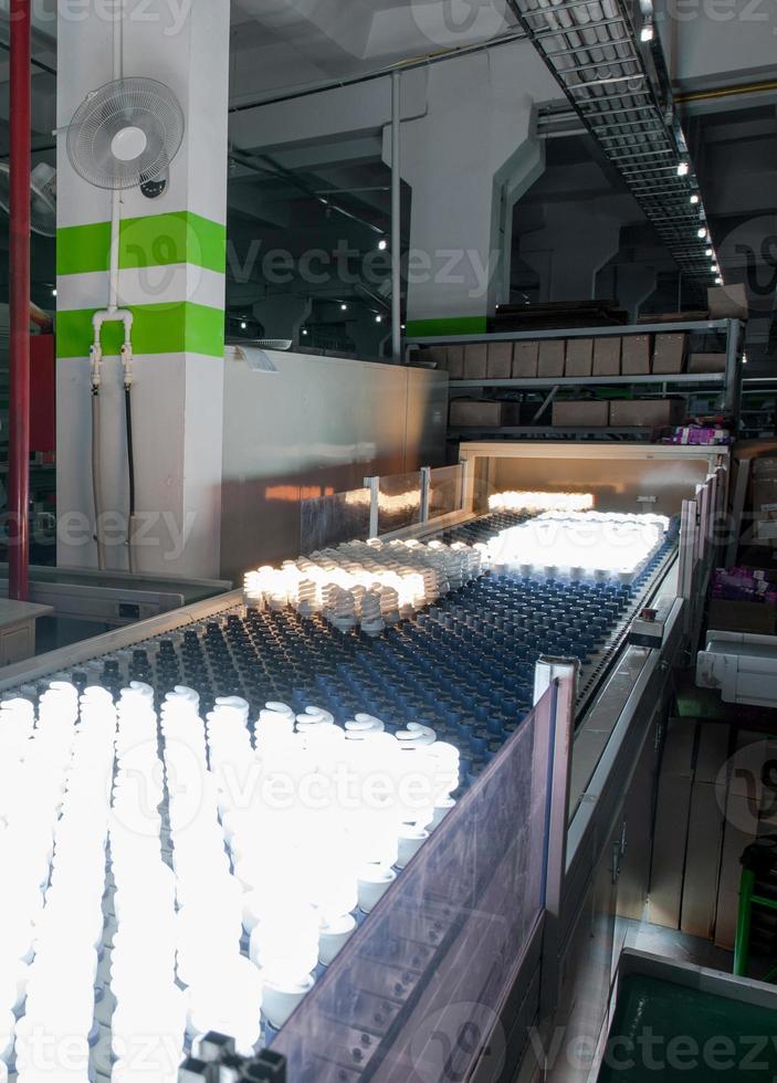 workshop for testing and verification, and packaging of halogen lamps on the assembly line photo