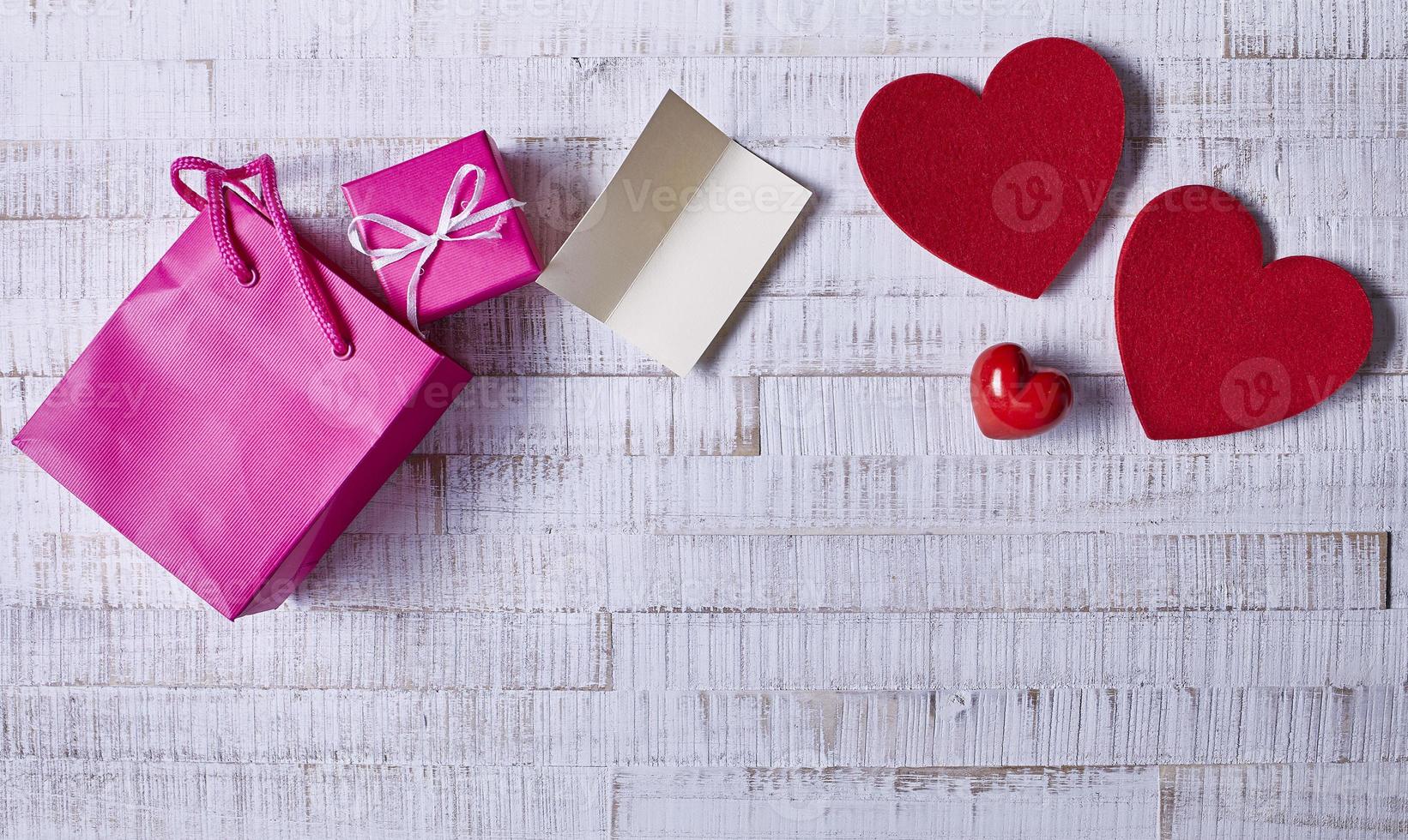 Valentine's Day Abstract Background with Hearts on Wood Texture photo