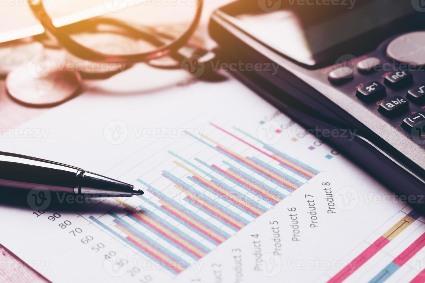 Summary report and business equipment managing financial on desk with finance savings concept. photo