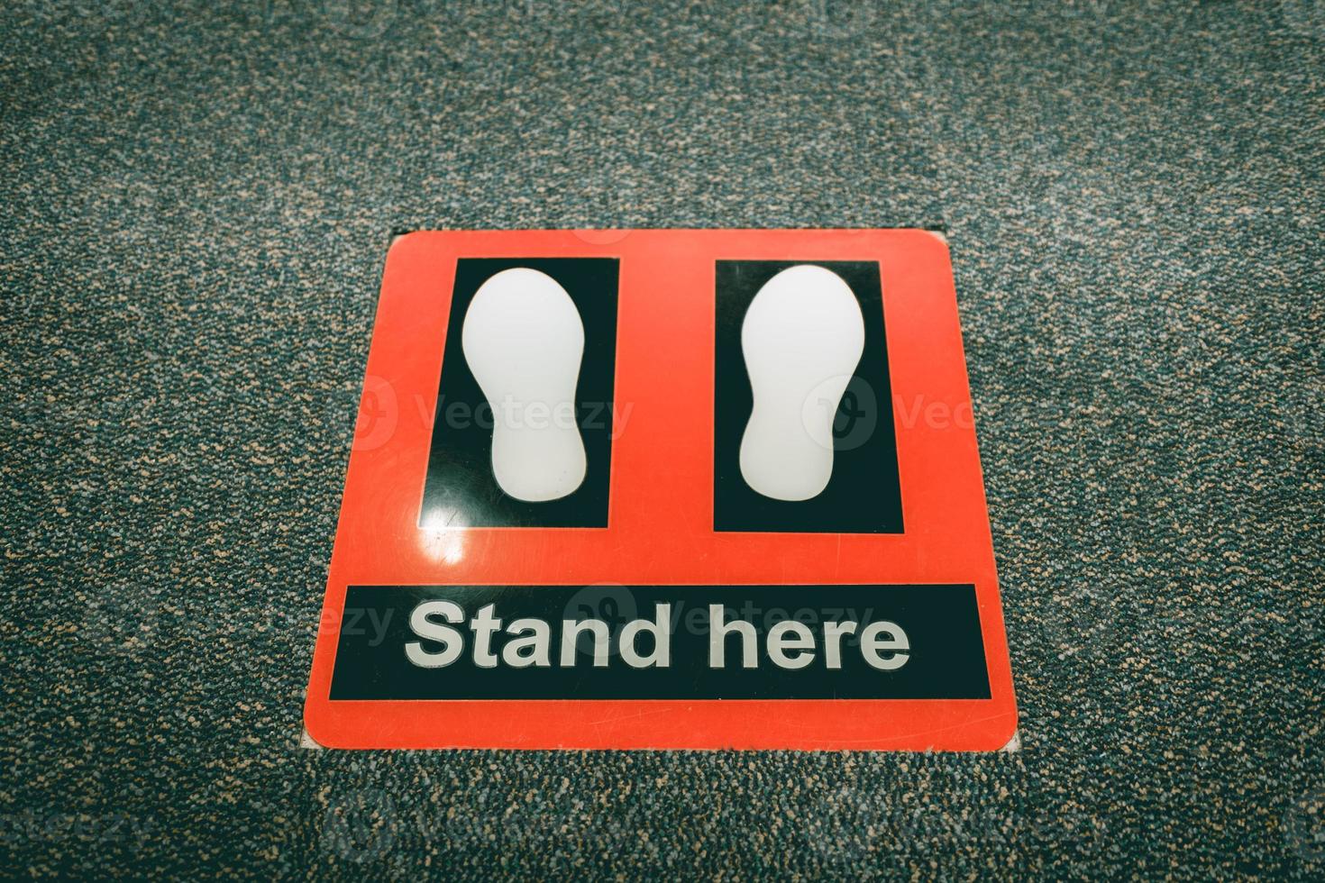 Stand here symbol in security checkpoint at airport. photo