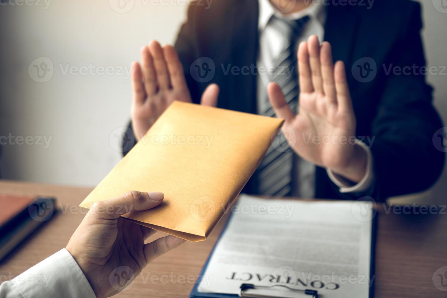 Businessmen are holding cash envelopes in order to bribe with the investment project participants corruption concept. photo
