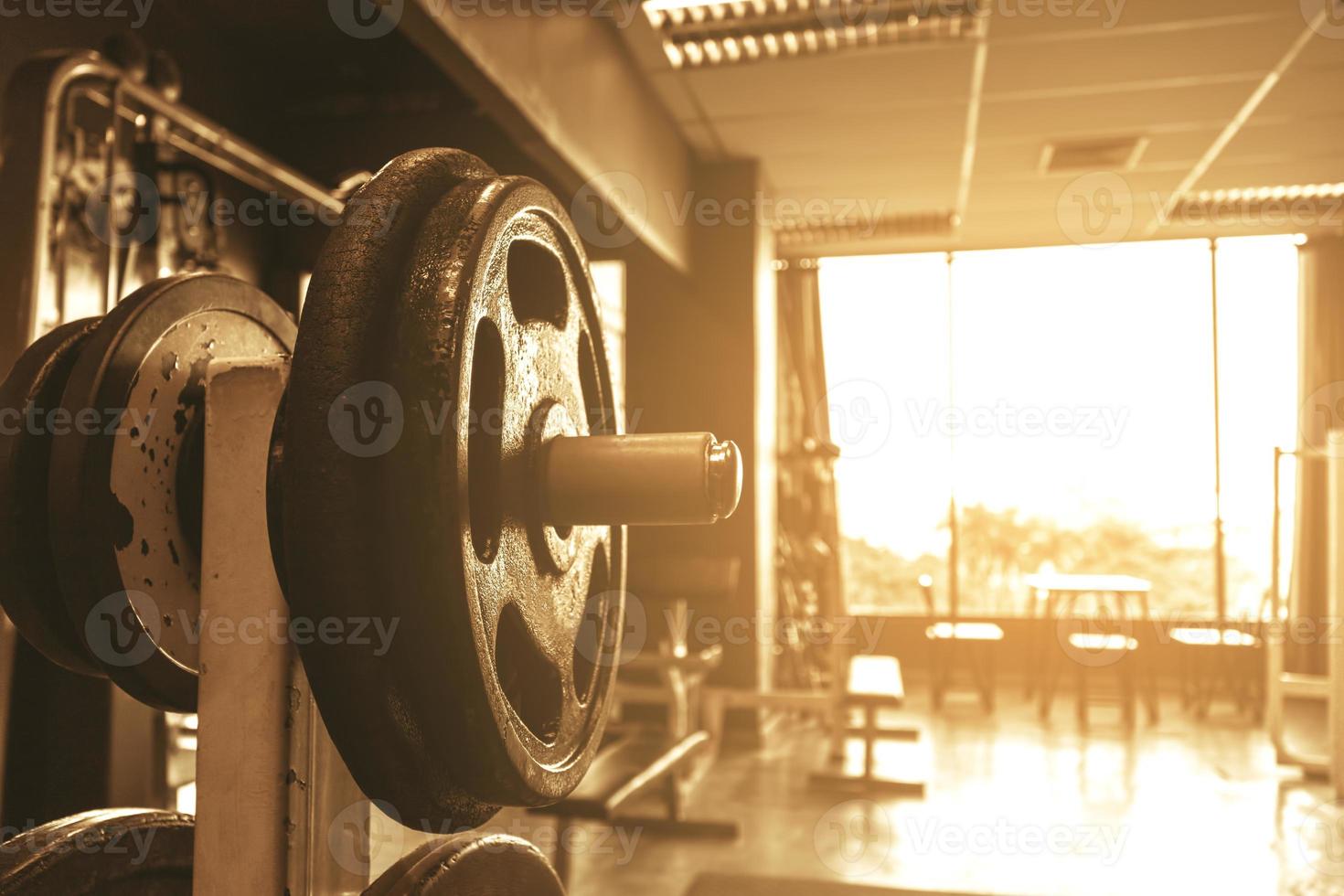 Dumbbell on barbell in club center fitness workout. photo