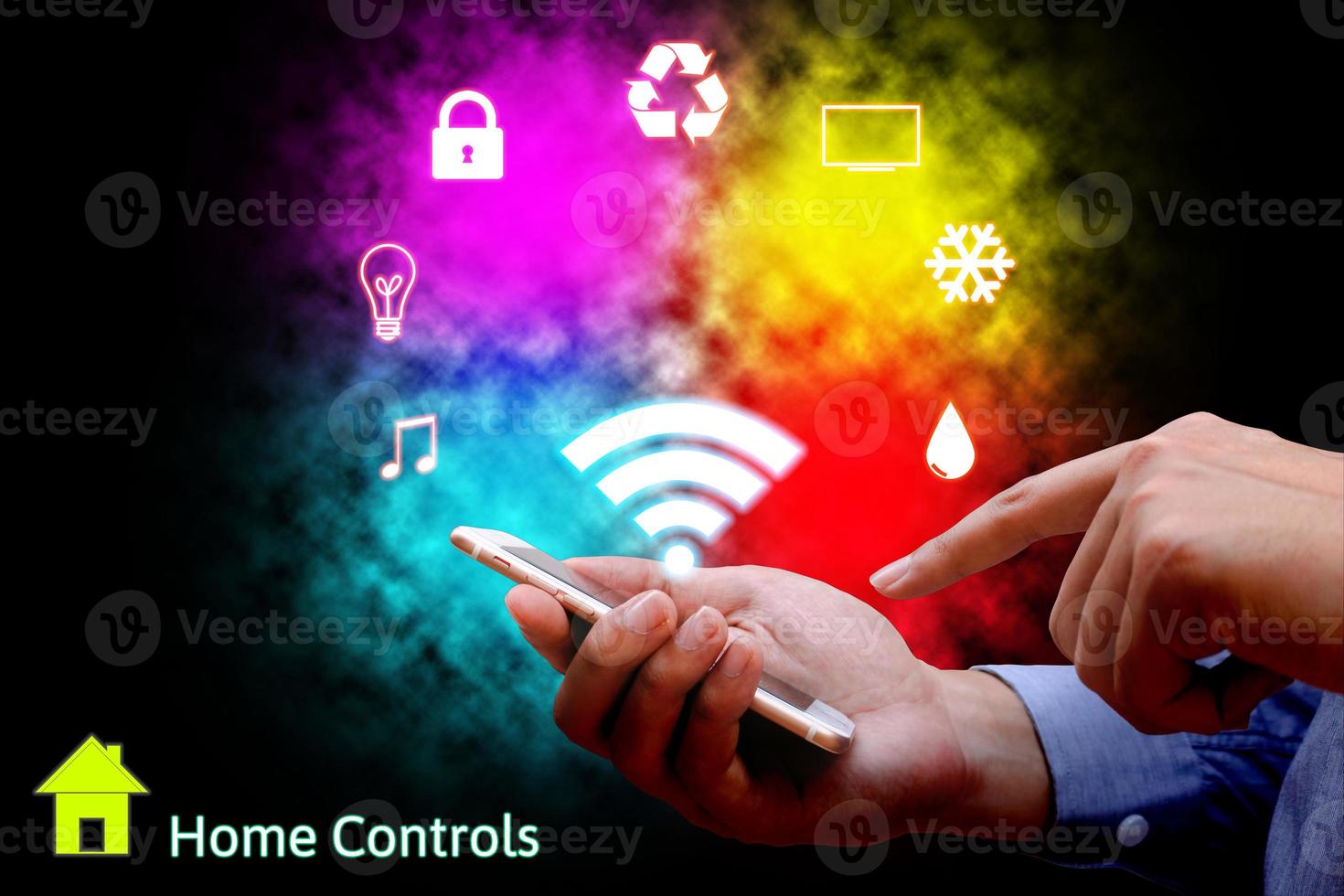 Man using smart phone or remote home control online home automation system. photo