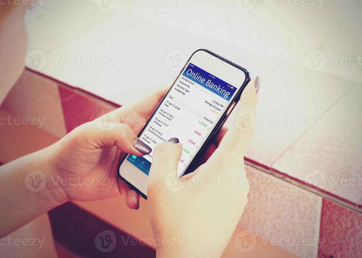 Young woman using mobile banking with smartphone. photo