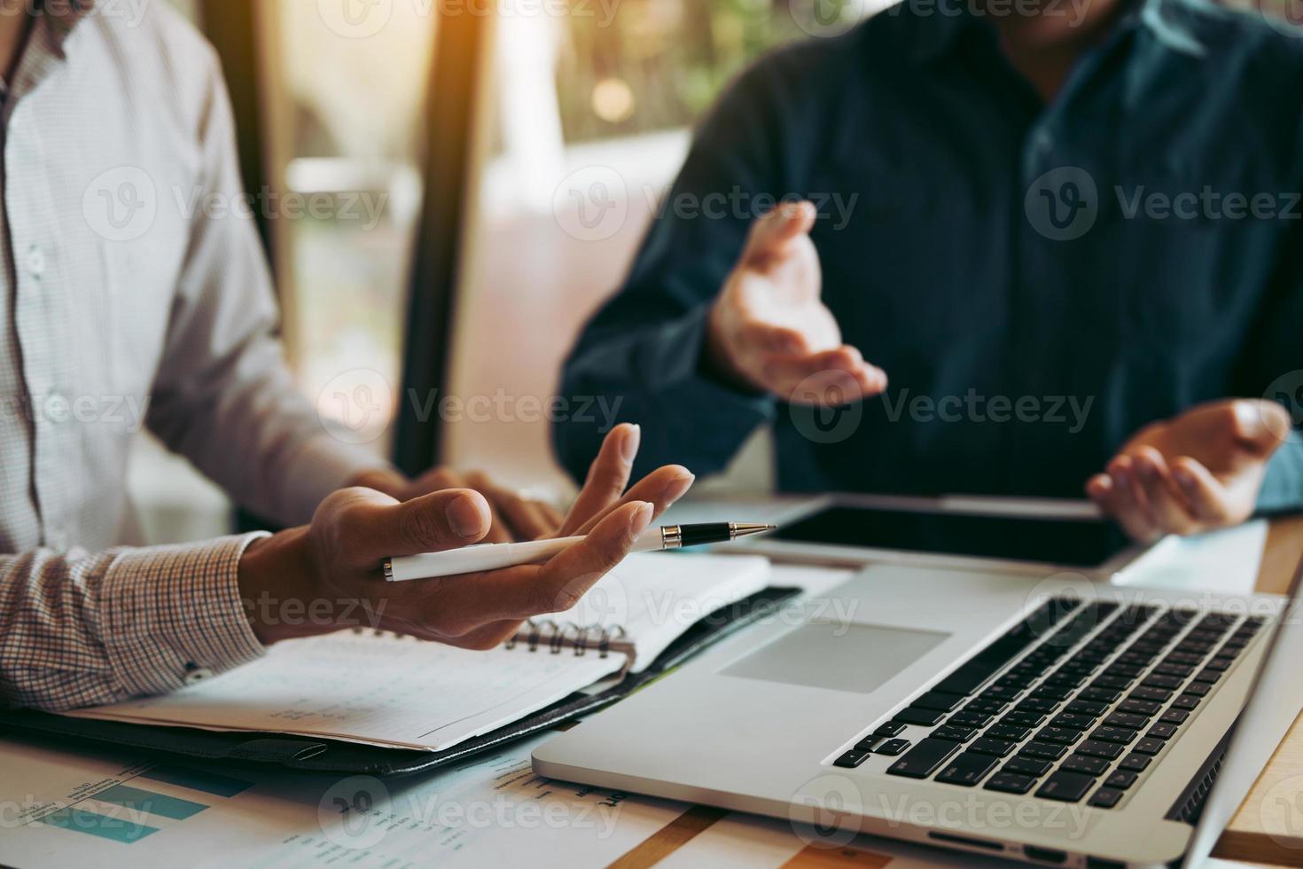 Two businessmen are talking about the wrong financial budget of the company and the correct analysis. photo