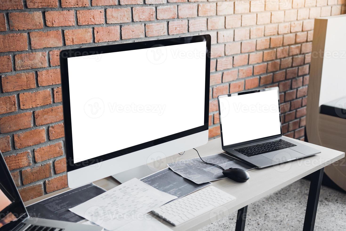 Computer of the software developer on the desk in the room office. photo