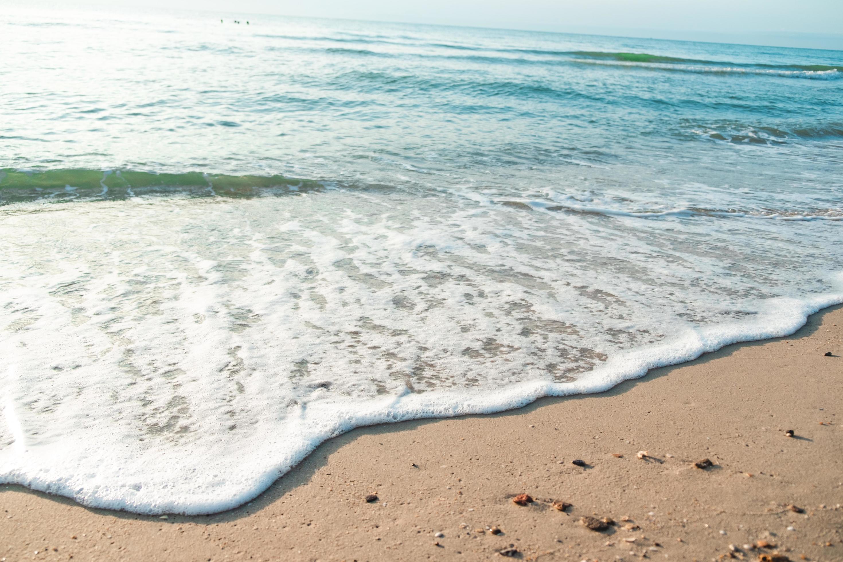 Close Up Wave Sand Beach Sea Foam. Closeup of sea wave with foam on
