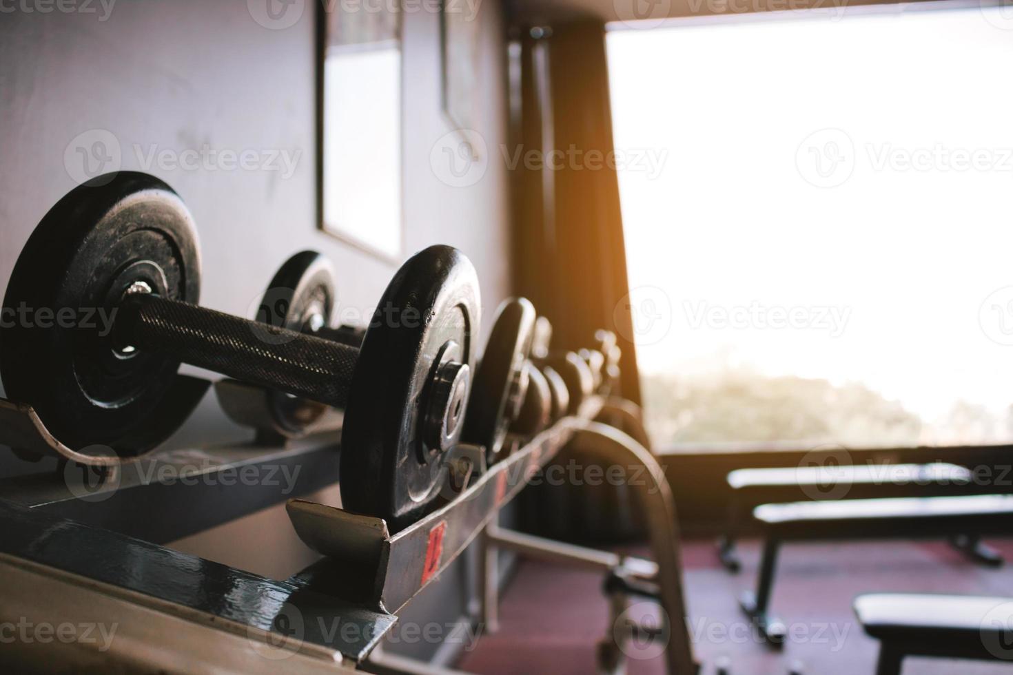 Dumbbell on barbell in club center fitness workout. photo