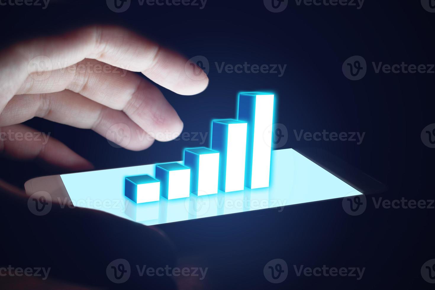 Man's hand protection for shield of graph business growth up on virtual screen in smart phone. photo