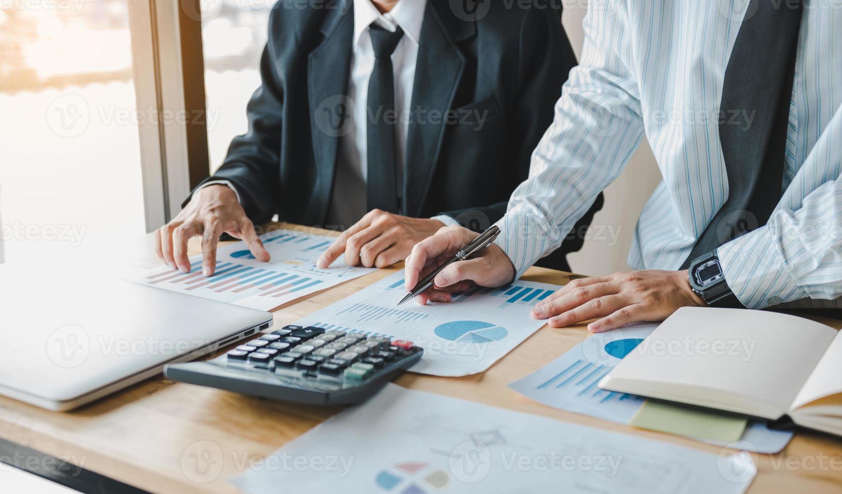 Business people working together at office room table and balancing budget. photo