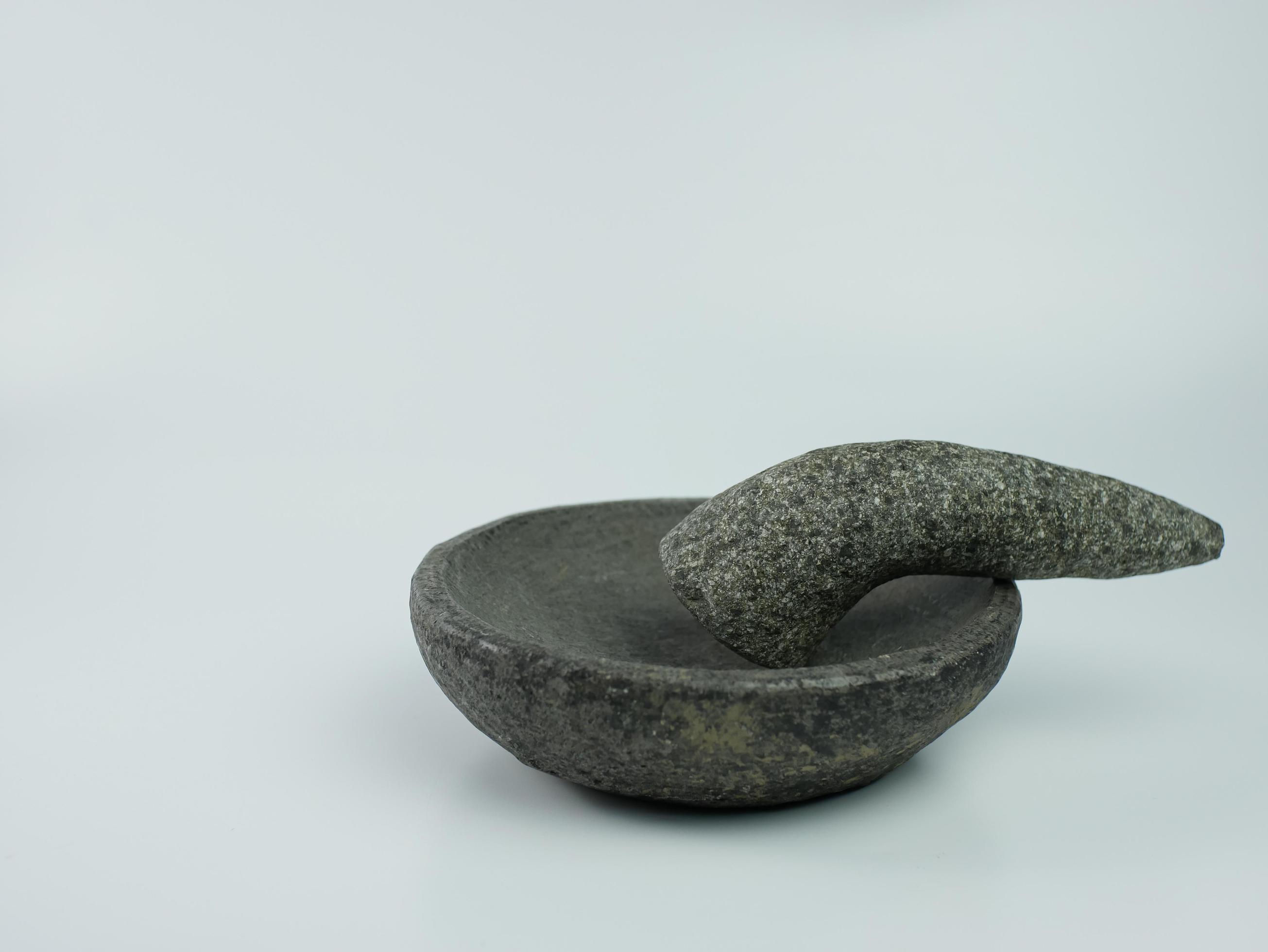 Indonesian traditional mortar and pestle isolated on a white background