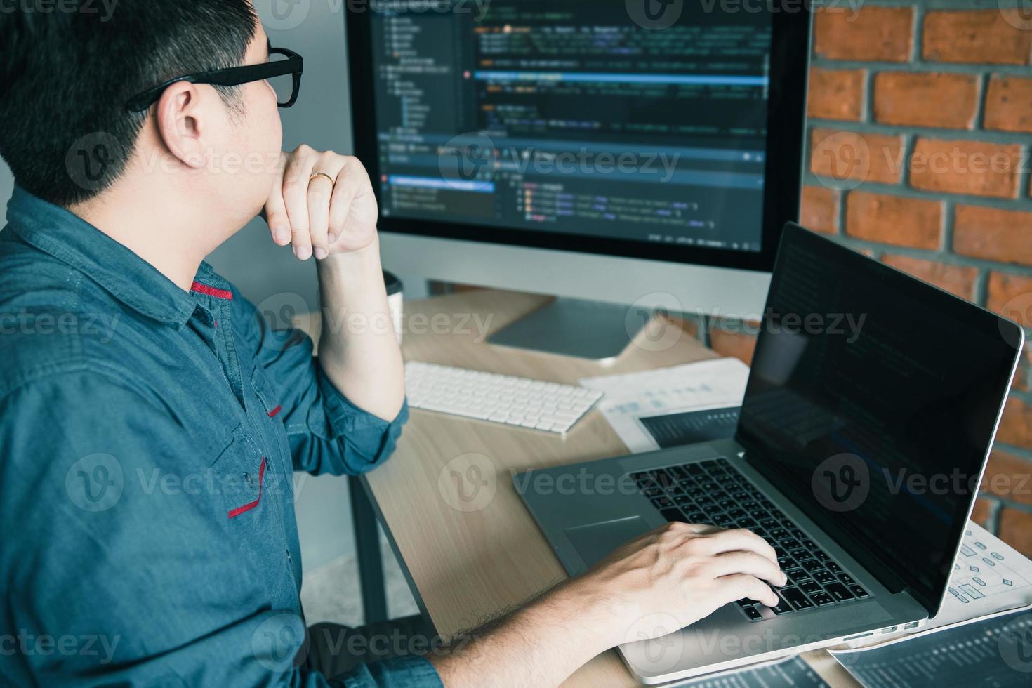 Developing programming and coding technology working in a software develop company office. photo