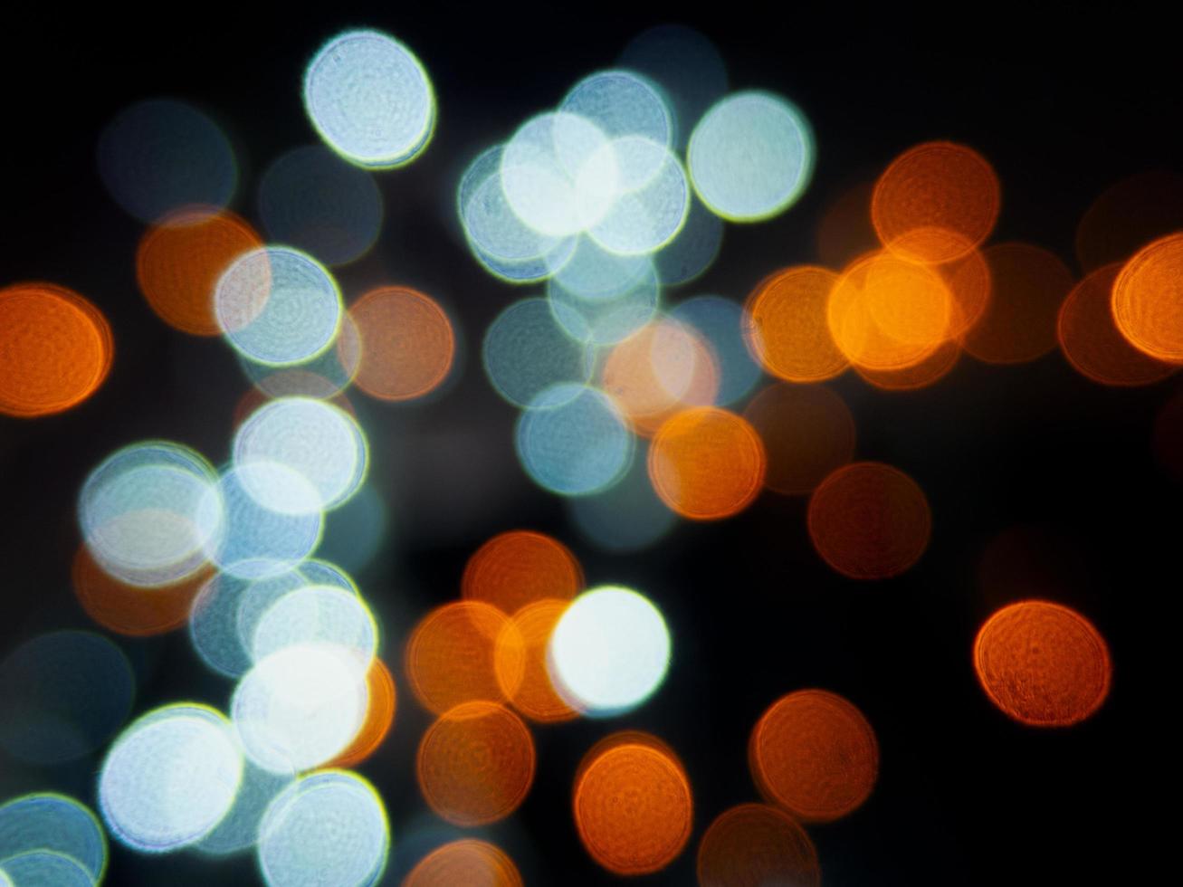blue bokeh background is overlaid with the orange and shines in the night. photo