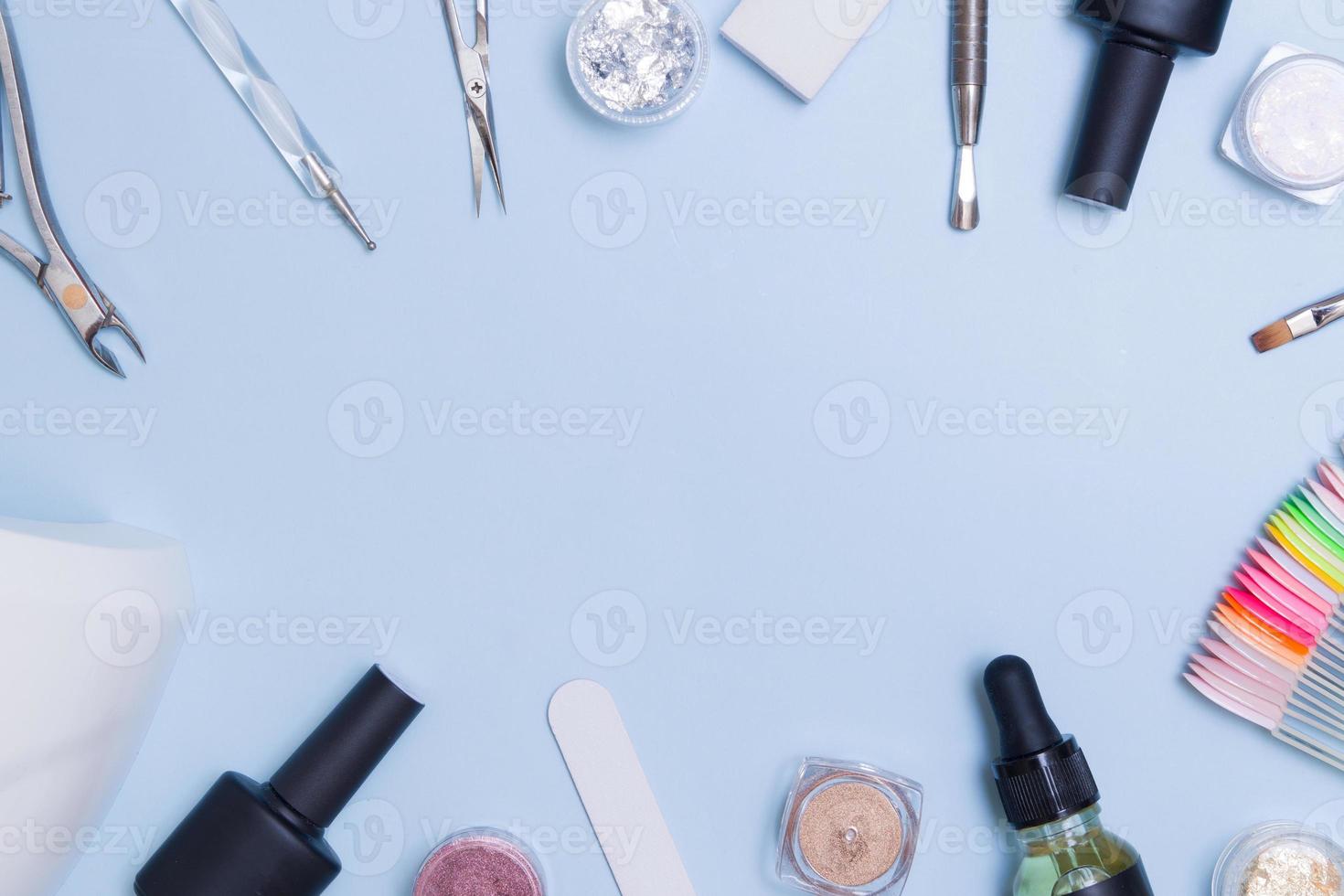 Frame from tools and materials for manicure flat lay with copy space. Creative manicure backgtound photo