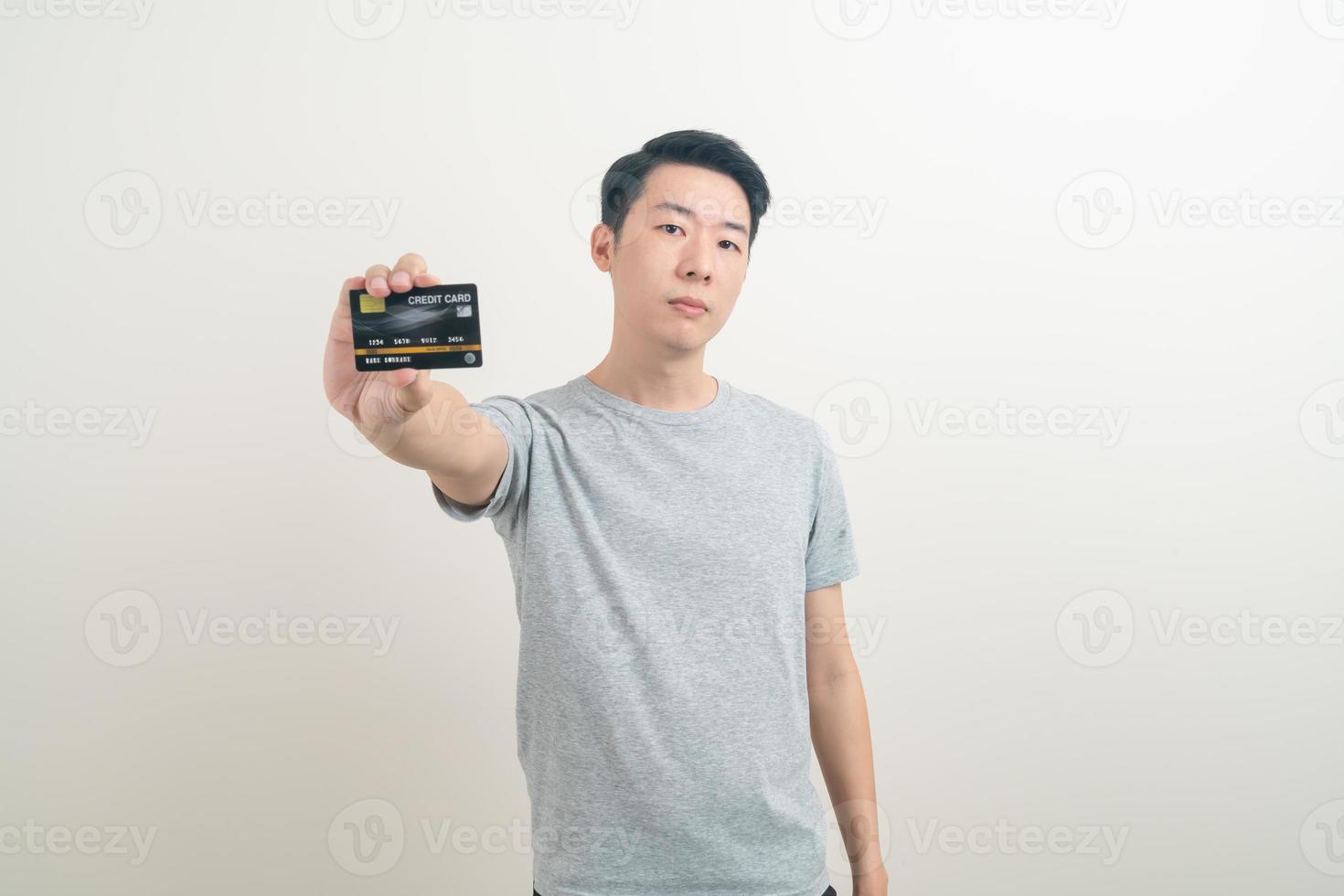 young Asian man holding credit card photo