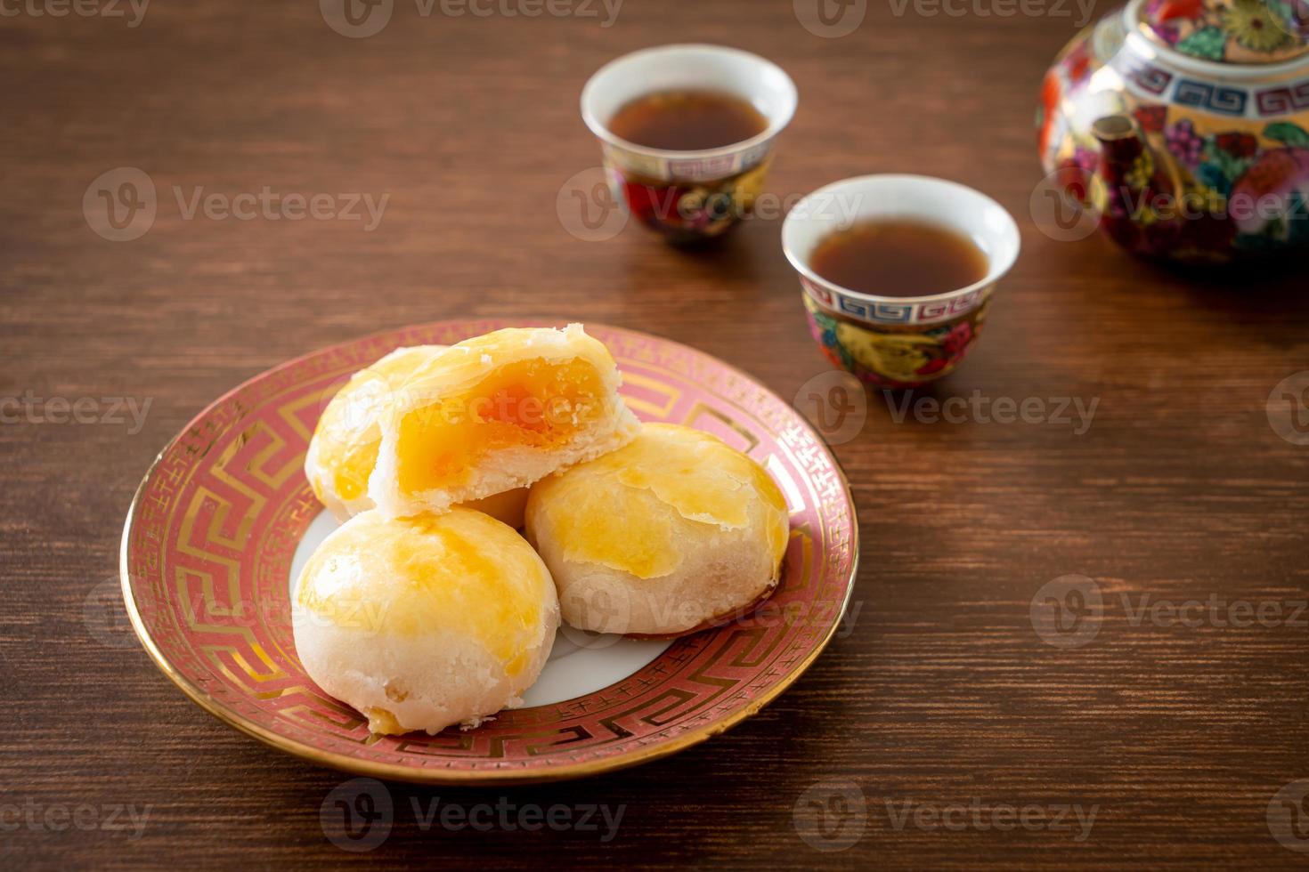 Chinese pastry moon cake with salted egg peanut or Spring Roll pastry with nuts and salted eggs photo